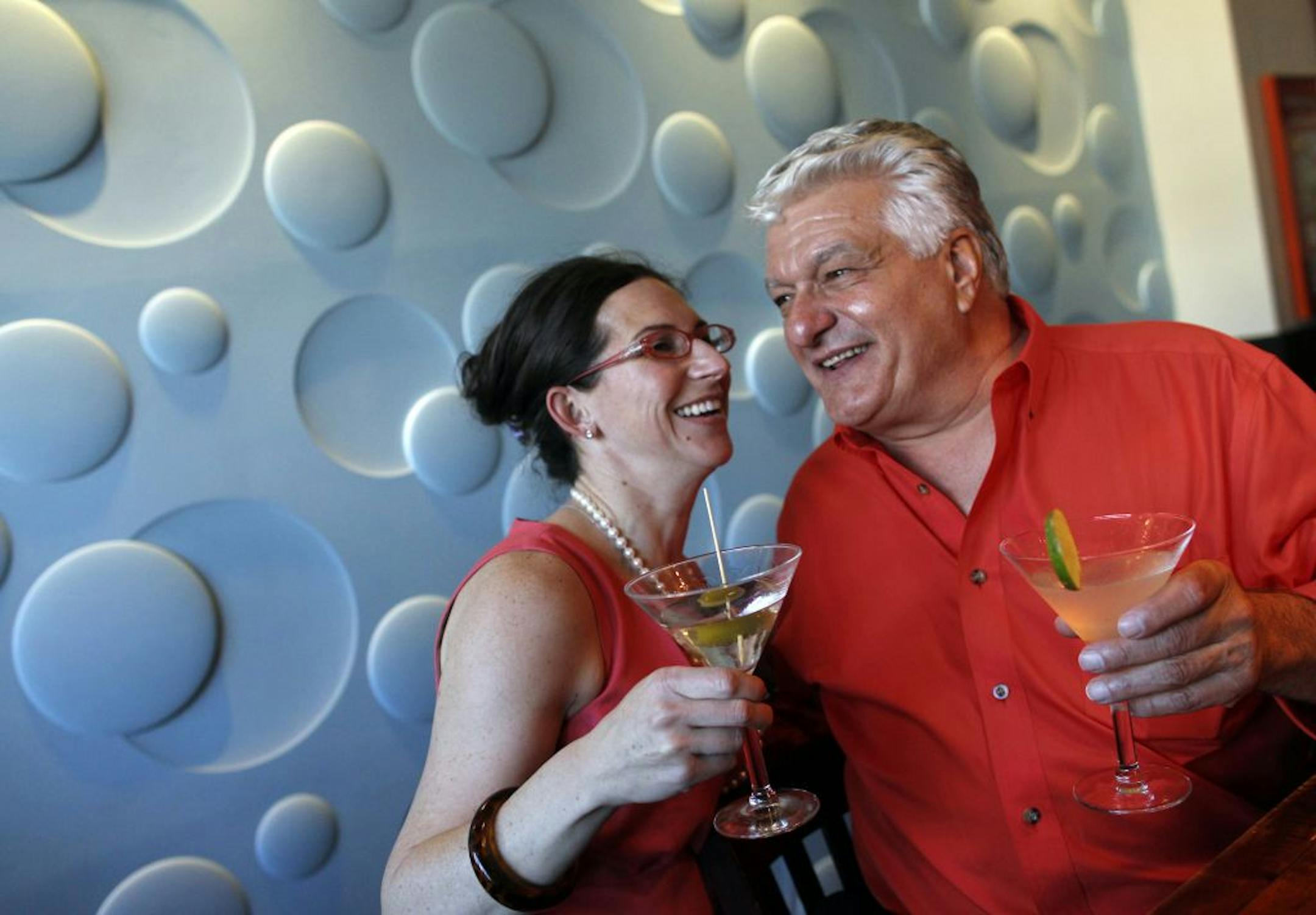 Edina Grill's Stephanie Shimp toasted the city's first happy hour with customer Michael Musto.