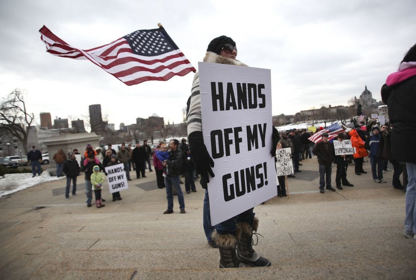 Second amendment supporter Meredith Mattison of Forest Lake made her point with a sign during the Capitol rally to protest new gun control legislation Saturday, Jan. 19, 2013, in St. Paul, MN.