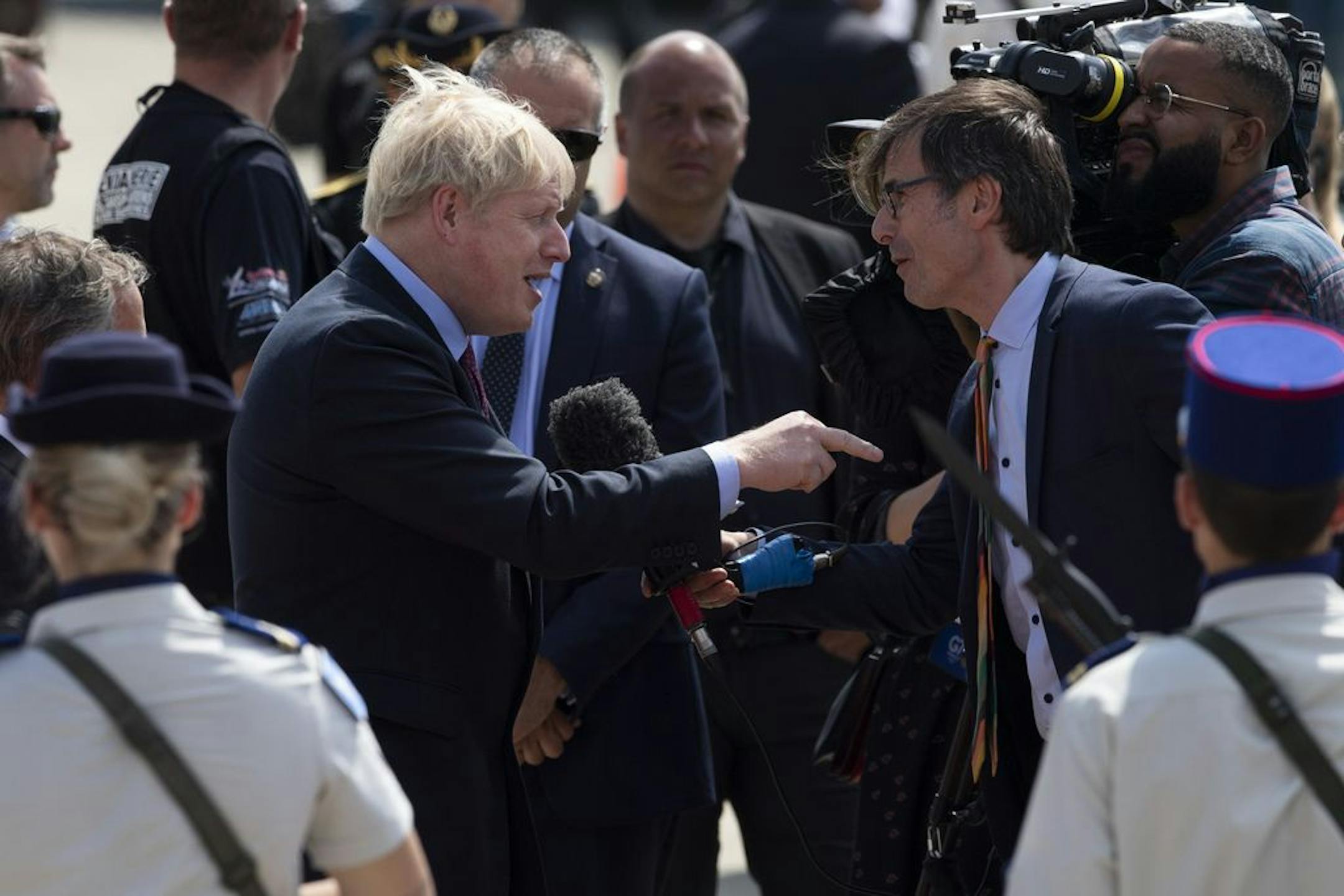 British Prime Minister Boris Johnson points during an interview upon his arrival at the airport in Biarritz, France, for the first day of the G-7 summit, Saturday, Aug. 24, 2019. U.S. President Donald Trump and the six other leaders of the Group of Seven nations will begin meeting Saturday for three days in the southwestern French resort town of Biarritz. France holds the 2019 presidency of the G-7, which also includes Britain, Canada, Germany, Italy and Japan.