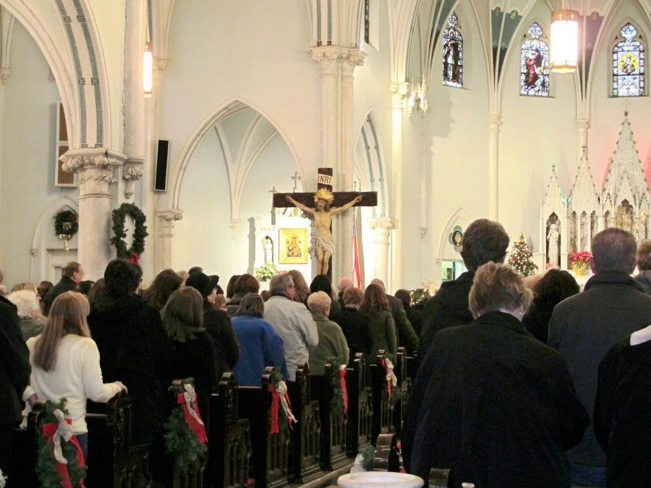 This Jan. 12, 2014 photo shows people gathered for mass inside Our Lady of Perpetual Help Church in Buffalo, N.Y., during a �Mass Mob.�