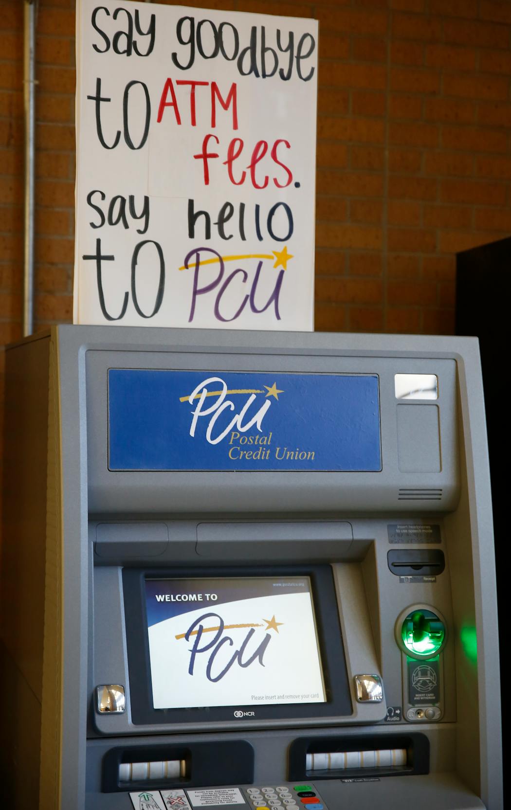 An ATM for Postal Credit Union at Tartan High School in Oakdale, photographed in 2013.