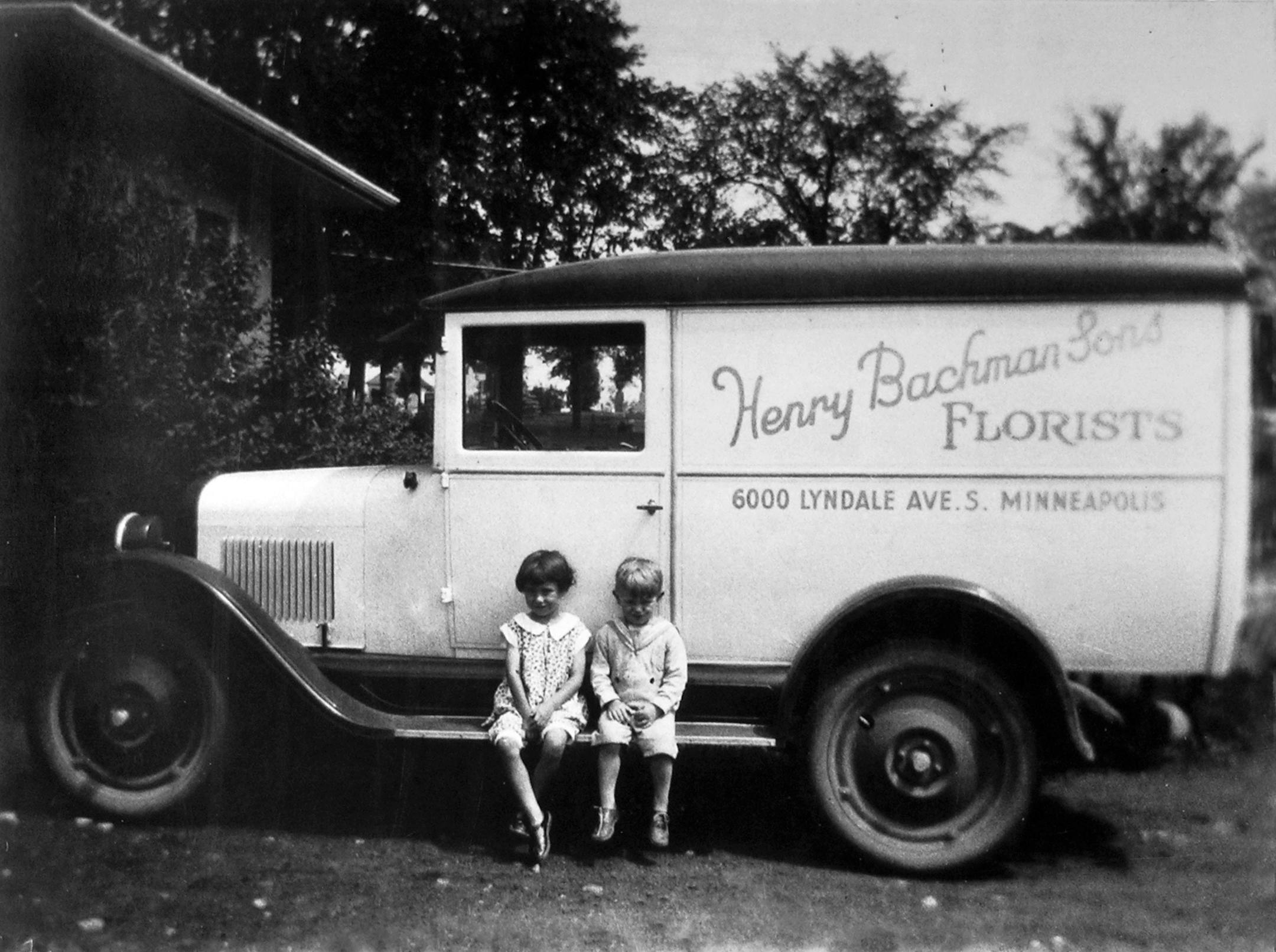 Grandchildren of Henry Bachman Sr., Luella and Larry, pose on the running board of the firm's delivery truck. Circa 1928.