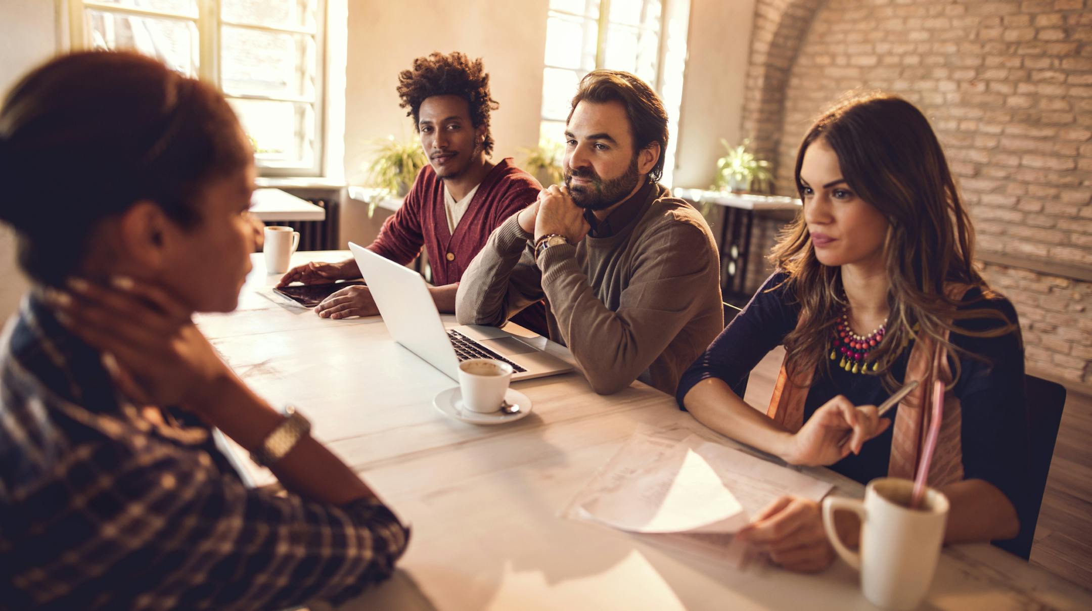 Business team listening to their potential colleague on a job interview in the office. Istock photo