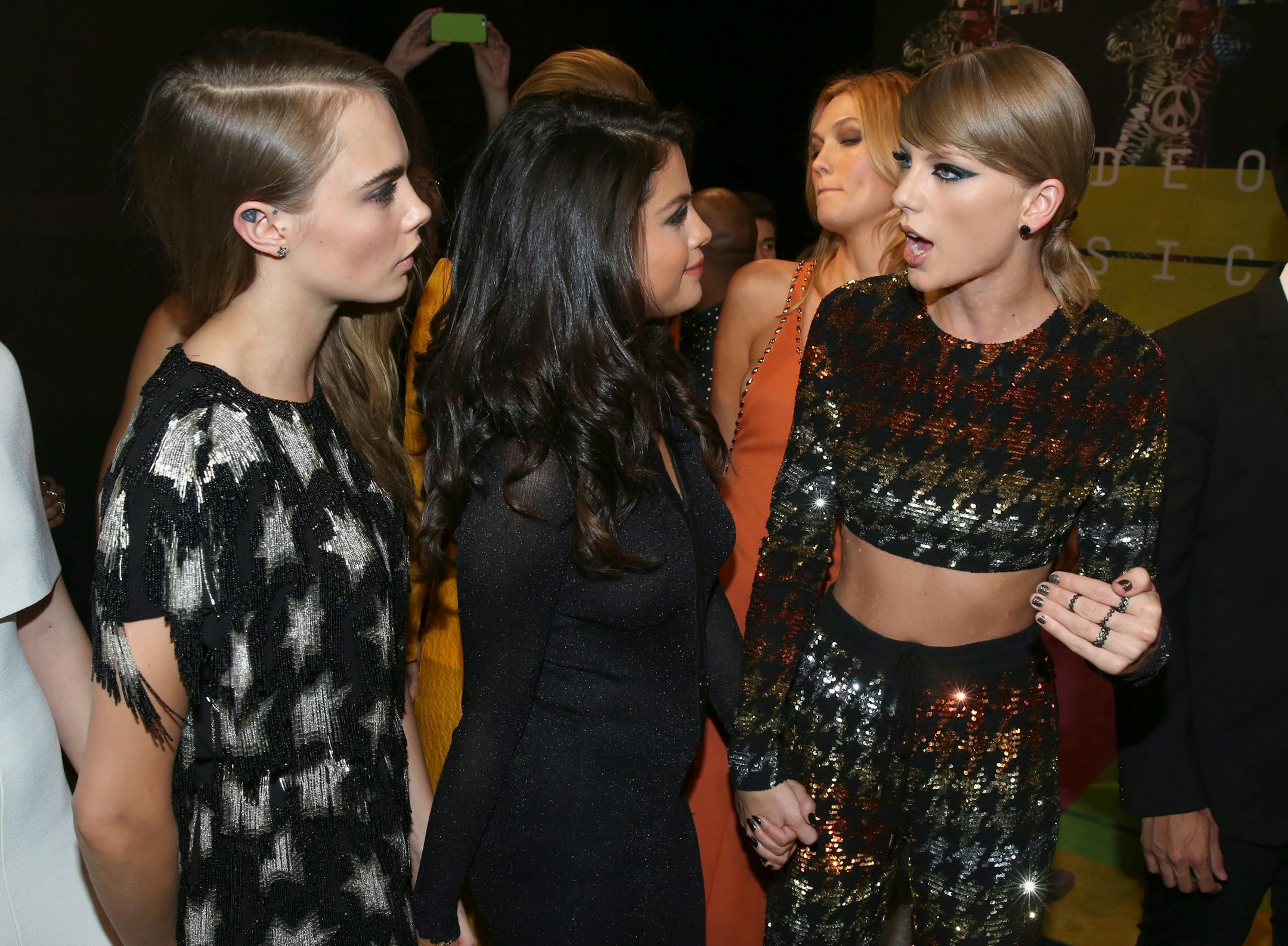 Taylor Swift, right, arrived at the MTV Video Music Awards on Aug. 30 with her celebrity BFFs Cara Delevingne, left, and Selena Gomez.