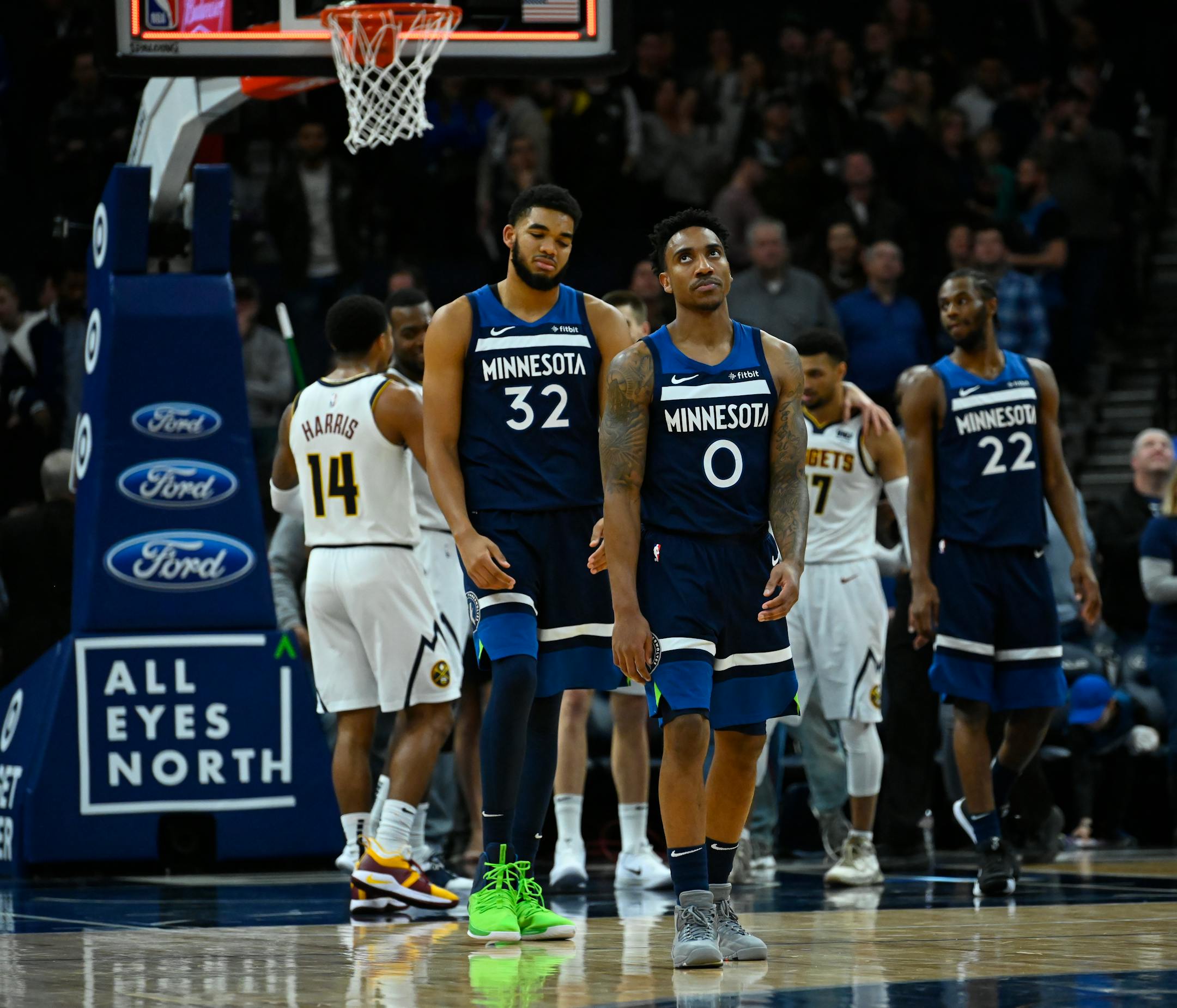 Timberwolves center Karl-Anthony Towns (32), guard Jeff Teague (0) and forward Andrew Wiggins (22) were dejected following their 103-101 loss to Denver on Wednesday night.