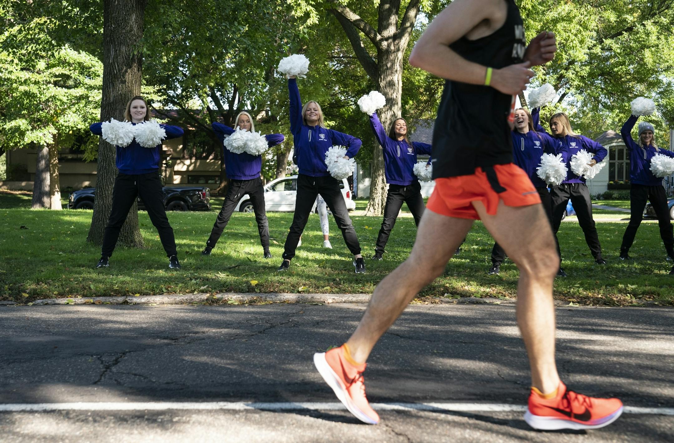 St. Thomas University Dance team members cheered for runners near mile 23.