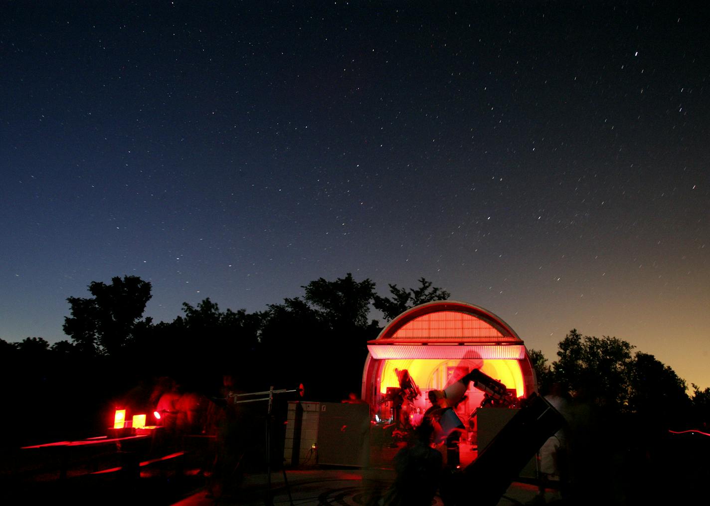 Visitors to Eagle Lake Observatory in Norwood Young America watched the sky using its powerful telescopes, as well as smaller telescopes that Minnesota Astronomical Society members had set up on the lawn.