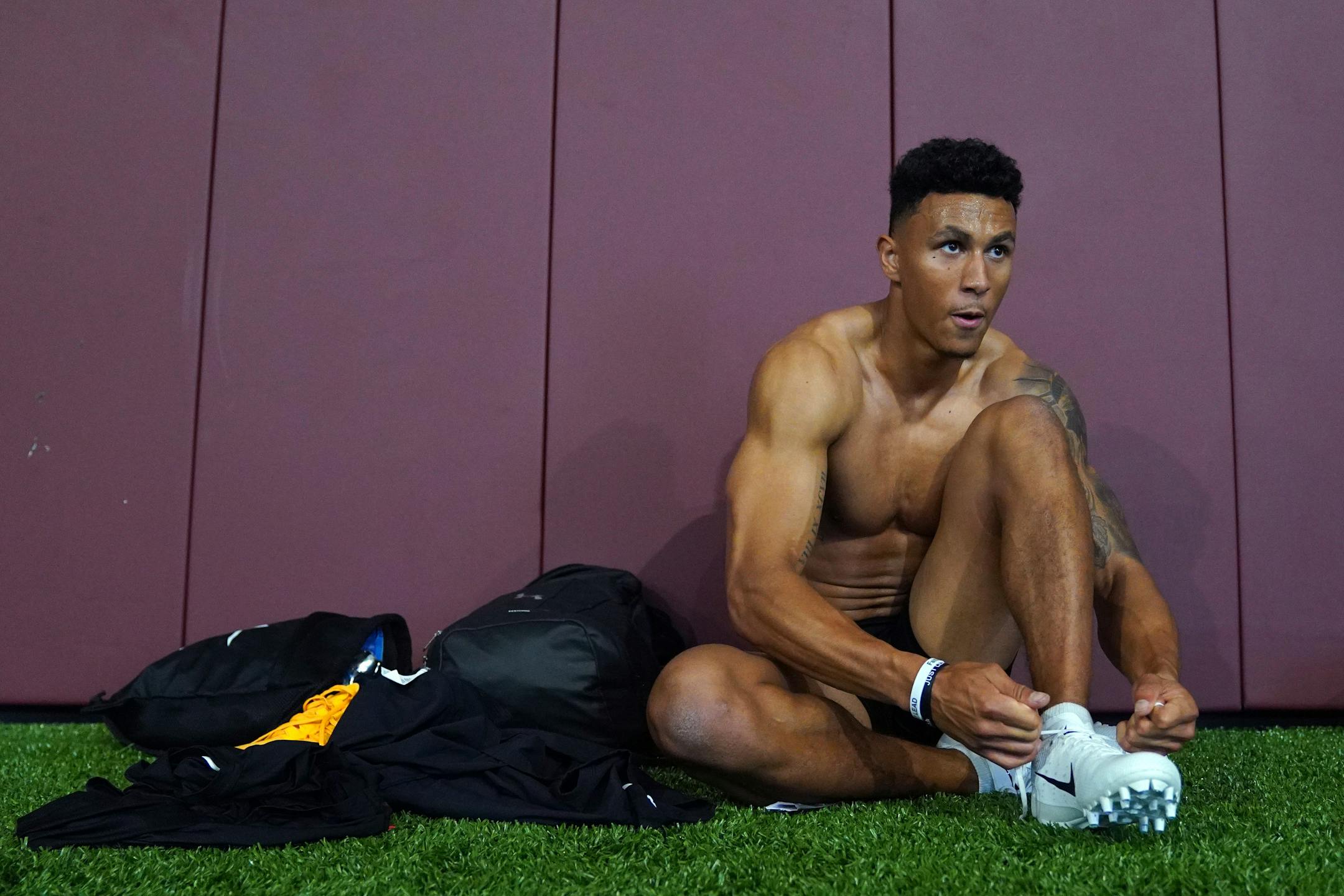 University of Minnesota cornerback Benjamin St-Juste took off his shoes after running sprints for NFL scouts during Pro Day.