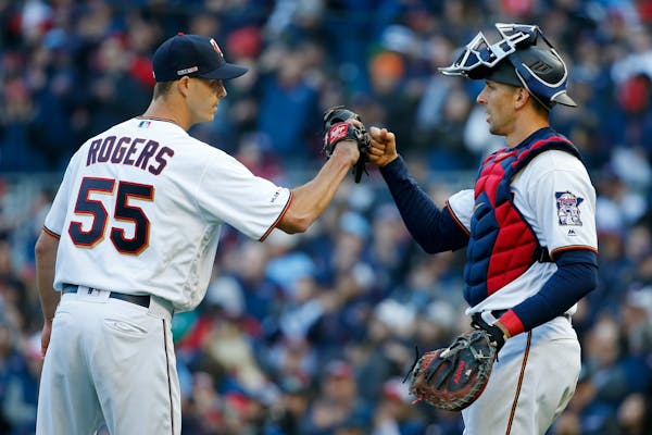 Twins pitcher Taylor Rogers and Jason Castro celebrated a victory against the Indians in March.