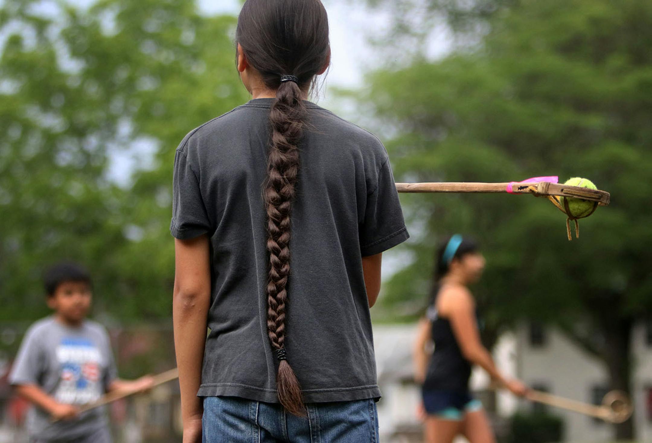 Youth boys team members of Twin Cities Native Lacrosse at practice, including Quinlan Grant at Corcoran Park Wednesday, June 17, 2015, in Minneapolis, MN. The traditional Lacrosse players, who play with hand carved ash sticks, were preparing for the upcoming Twin Cities Native Lacrosse Tournament at the Osseo High School Saturday.