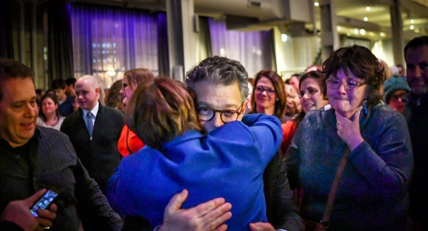 Sen. Al Franken hugged Sen. Amy Klobuchar at the end of his speech Thursday night in Minneapolis.