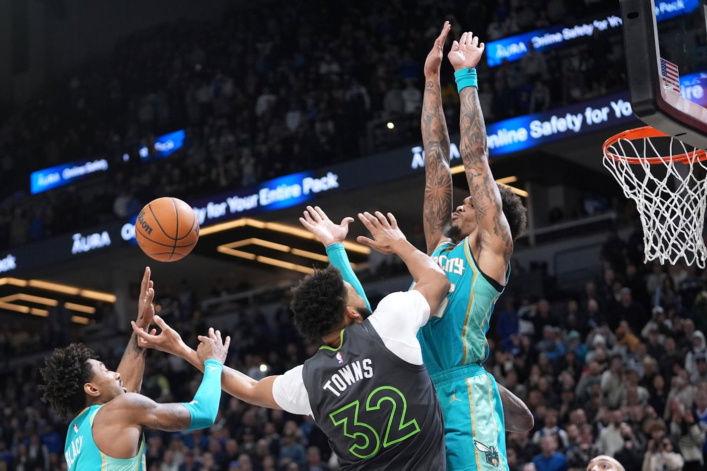 Karl-Anthony Towns (32) loses control of the ball while attempting a shot.