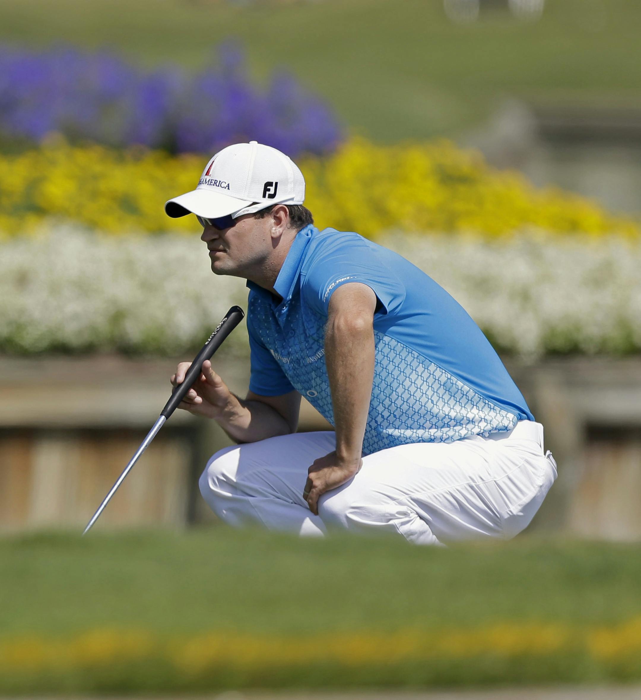 Zach Johnson lines up a putt on the 17th green during the second round of The Players Championship golf tournament at TPC Sawgrass, Friday, May 10, 2013, in Ponte Vedra Beach, Fla. (AP Photo/John Raoux) ORG XMIT: MIN2013052217180494