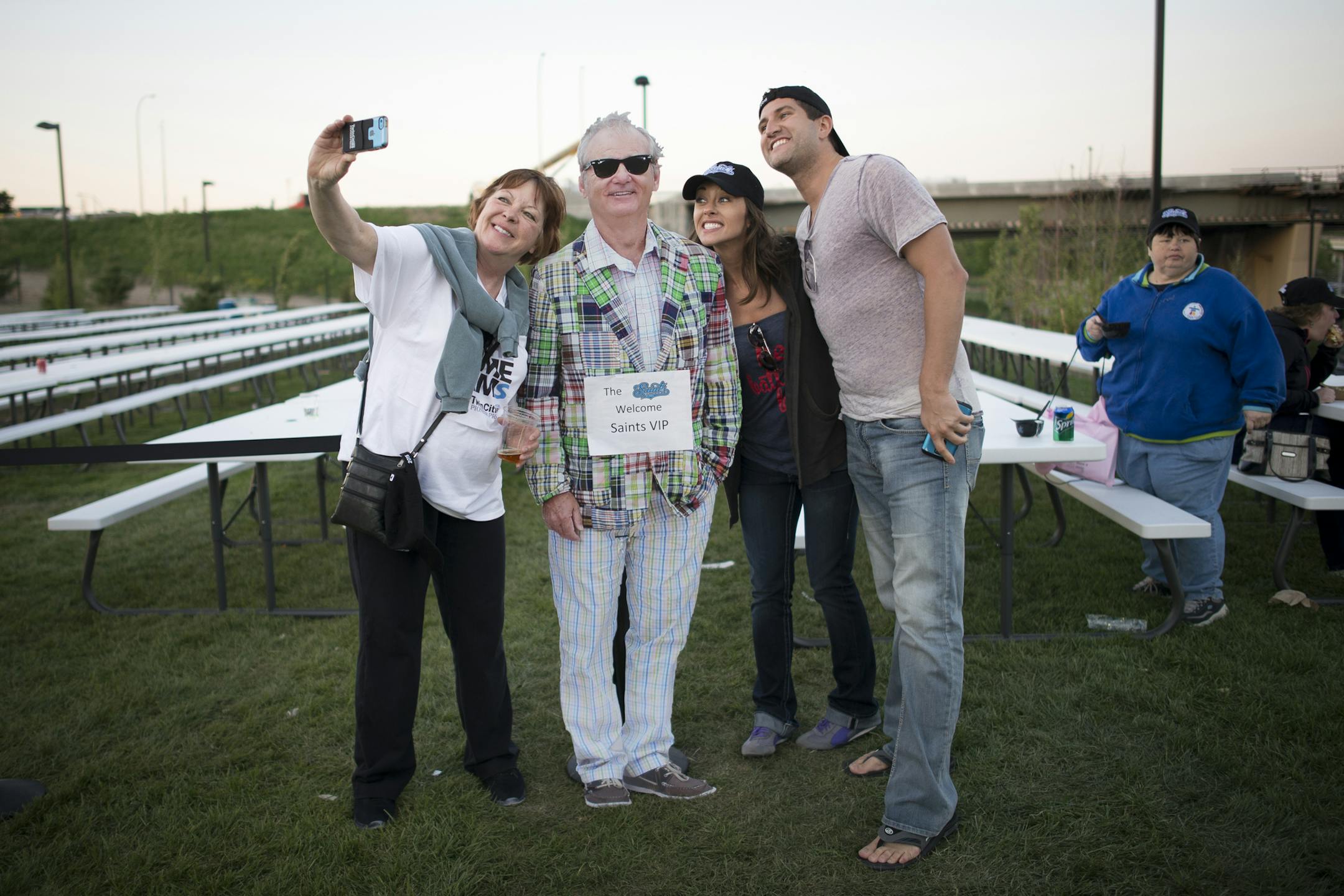 From left, Kathy Berdan, Alison Jacobs and Michael Purkey took a selfie with a cardboard cutout of Bill Murray Thursday night at the St. Paul Saints home opener. ] Aaron Lavinsky &#x2022; aaron.lavinsky@startribune.com The St. Paul Saints hold their season opener against the Fargo-Moorhead Redhawks at brand-new CHS Field on Thursday, May 21, 2015.