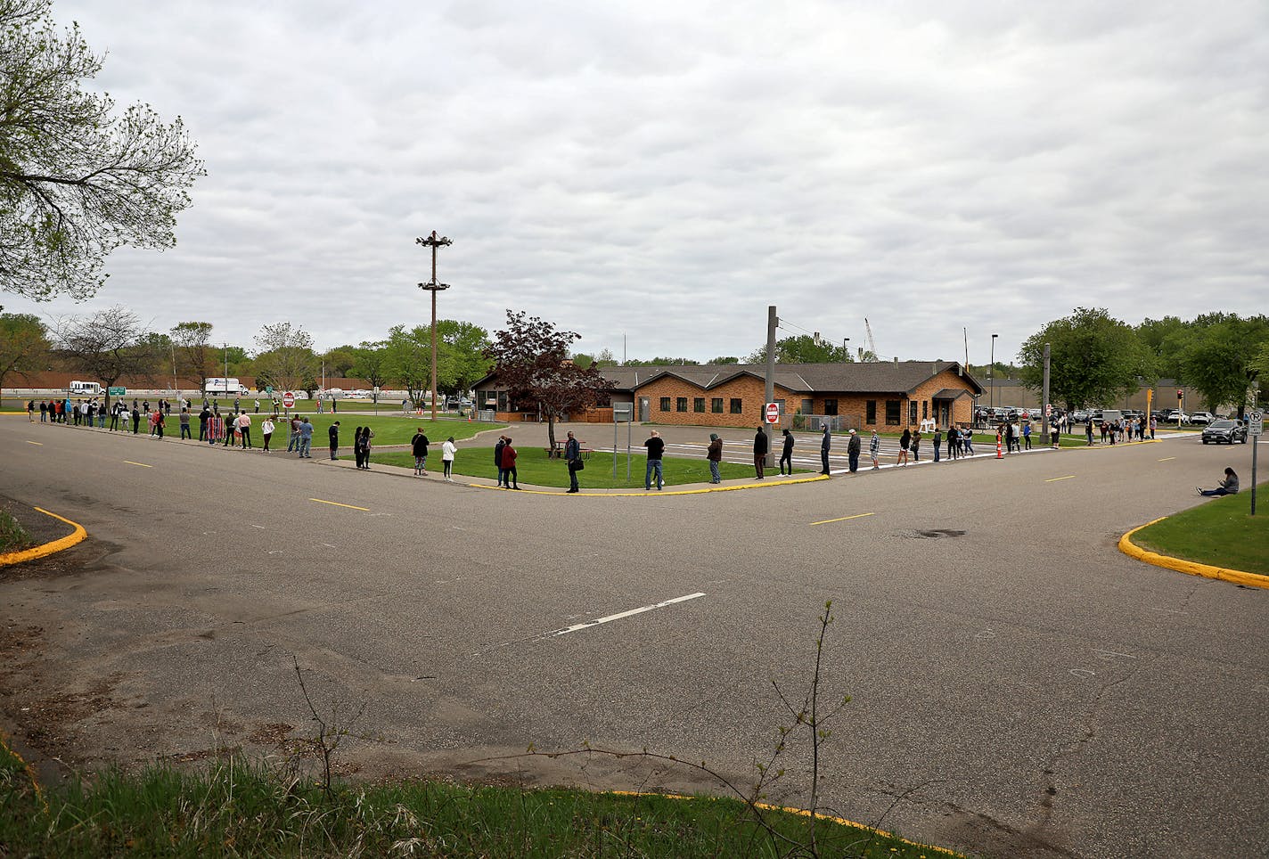 Fourteen DVS exam stations reopened Tuesday, including this one in Arden Hills where during the mid-morning an estimated 200 people waited outside in a line that stretched around the entire block to get into the building.