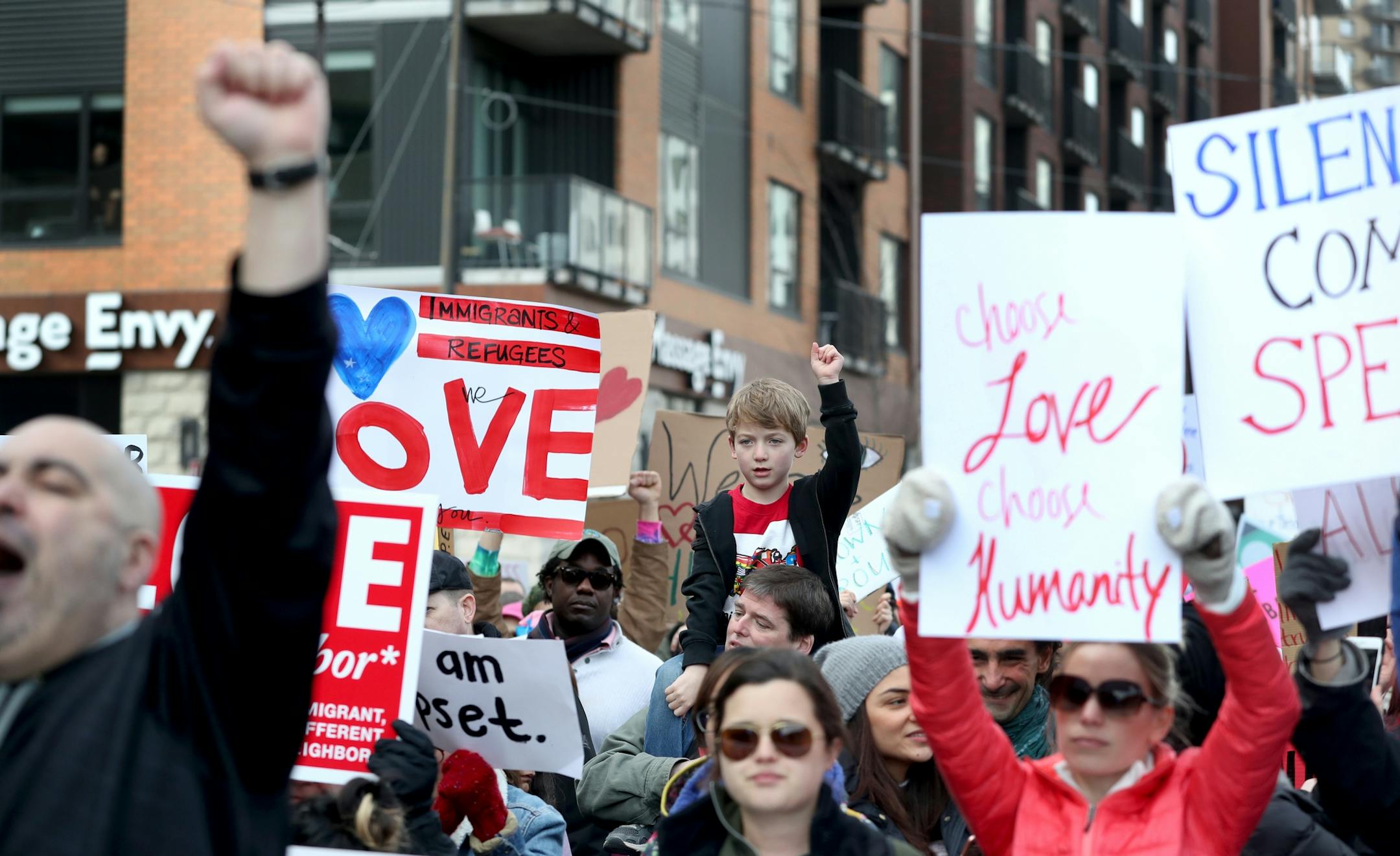 Young and old marched in The Caravan of Love: A Walk of Love for Immigrants and Refugees as it moved from the Minneapolis City Hall down Washington Ave. towards the Cedar-Riverside neighborhood Saturday, Feb. 11, 2016, in Minneapolis, MN.