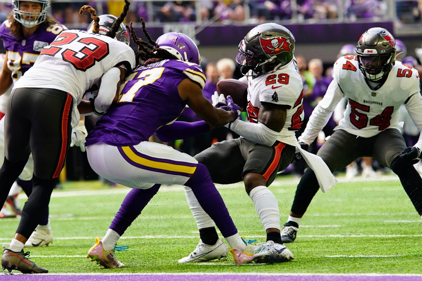 Tampa Bay Buccaneers safety Christian Izien (29) intercepts a pass intended for Minnesota Vikings wide receiver K.J. Osborn (17) during the first half of an NFL football game, Sunday, Sept. 10, 2023, in Minneapolis. (AP Photo/Abbie Parr)