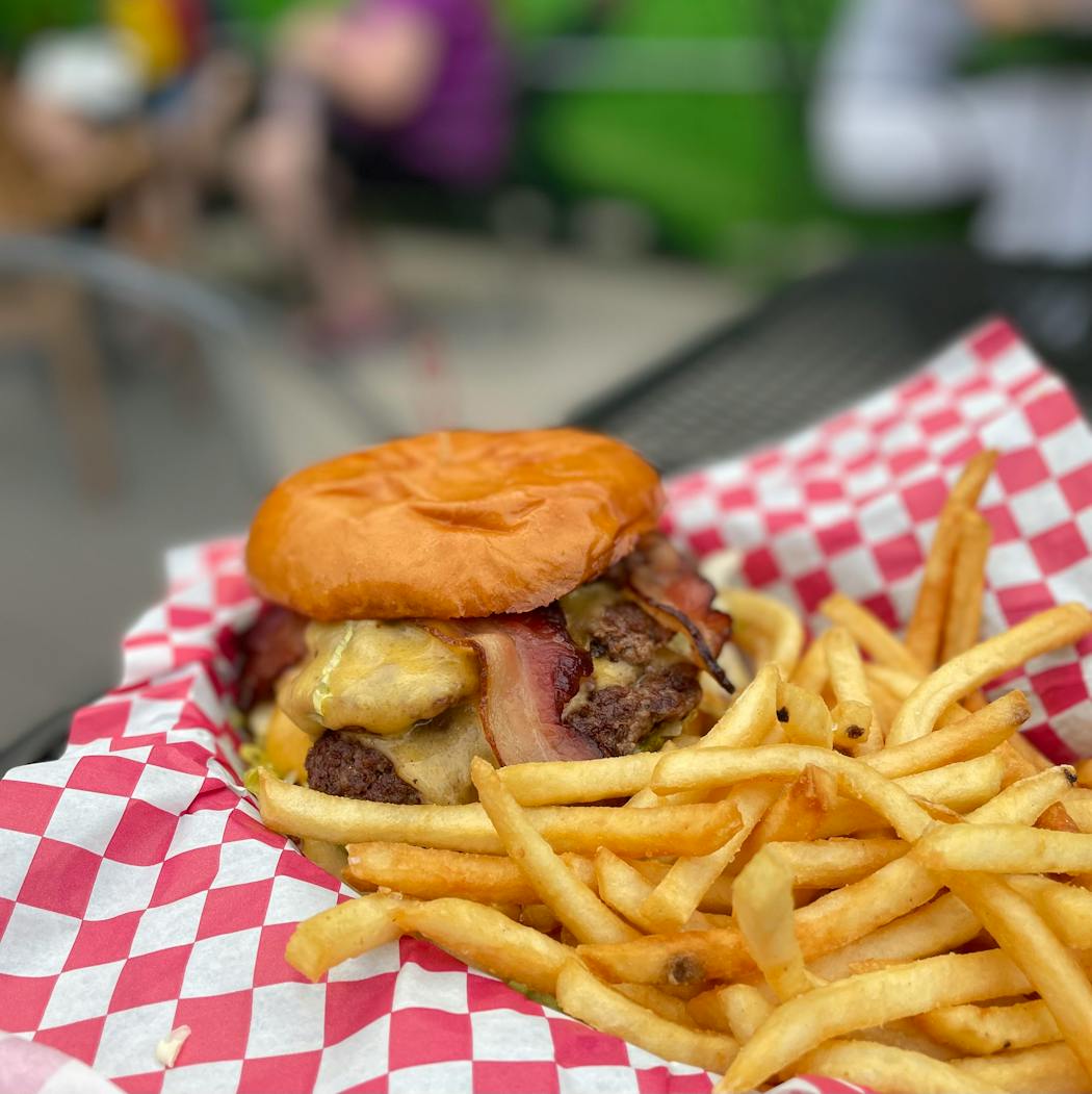 There’s no shortage of great burgers to enjoy this summer, but this one comes with a dose of neighborhood atmosphere.