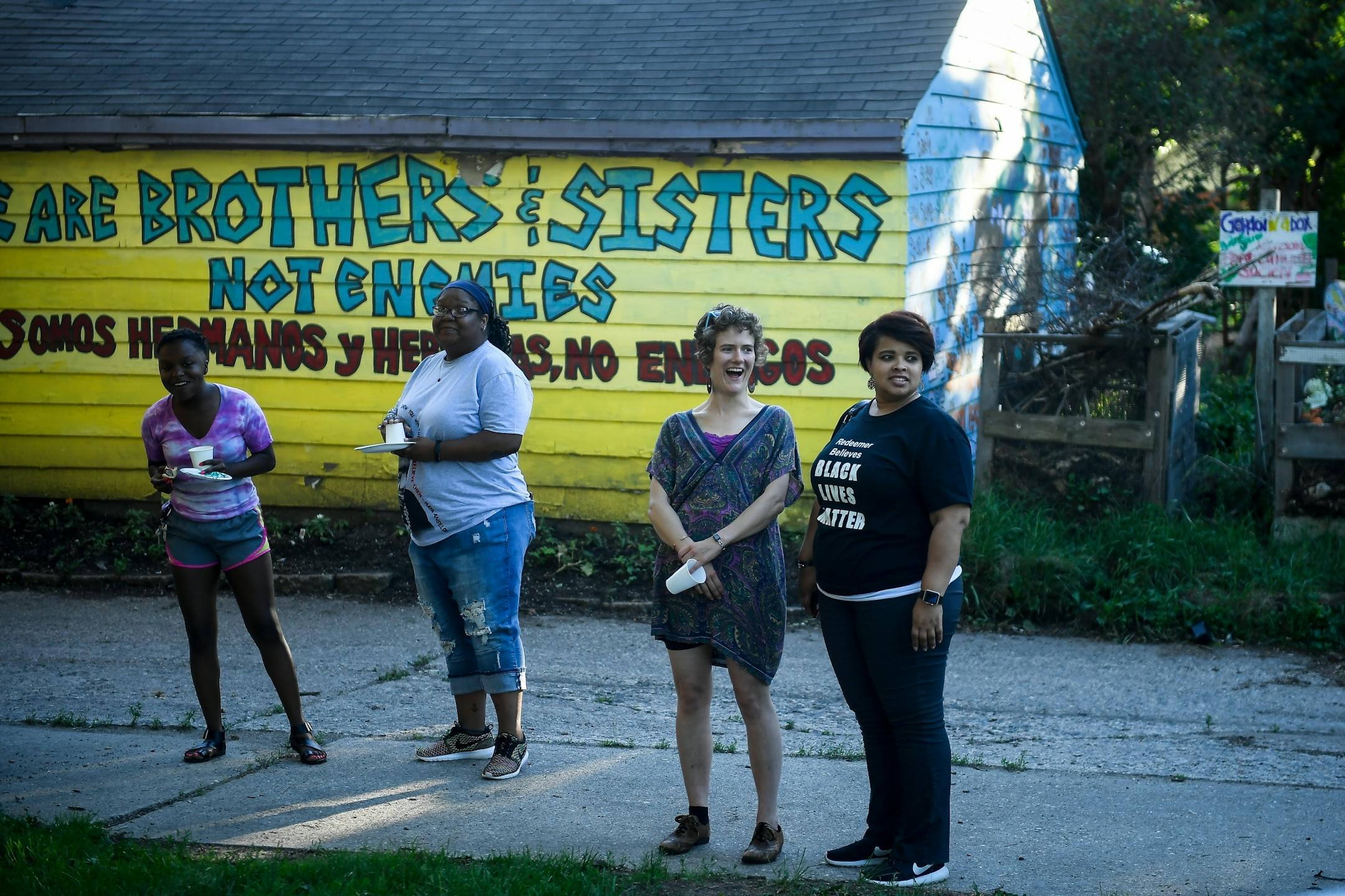 From left, Kitana Holland, Redeemer community leadership intern supervisor Jennifer Dodd, Carrie Hatcher, and Redeemer associate director of community engagement Jia Brown attended Wednesday night's community cookout at Redeemer Lutheran Church.