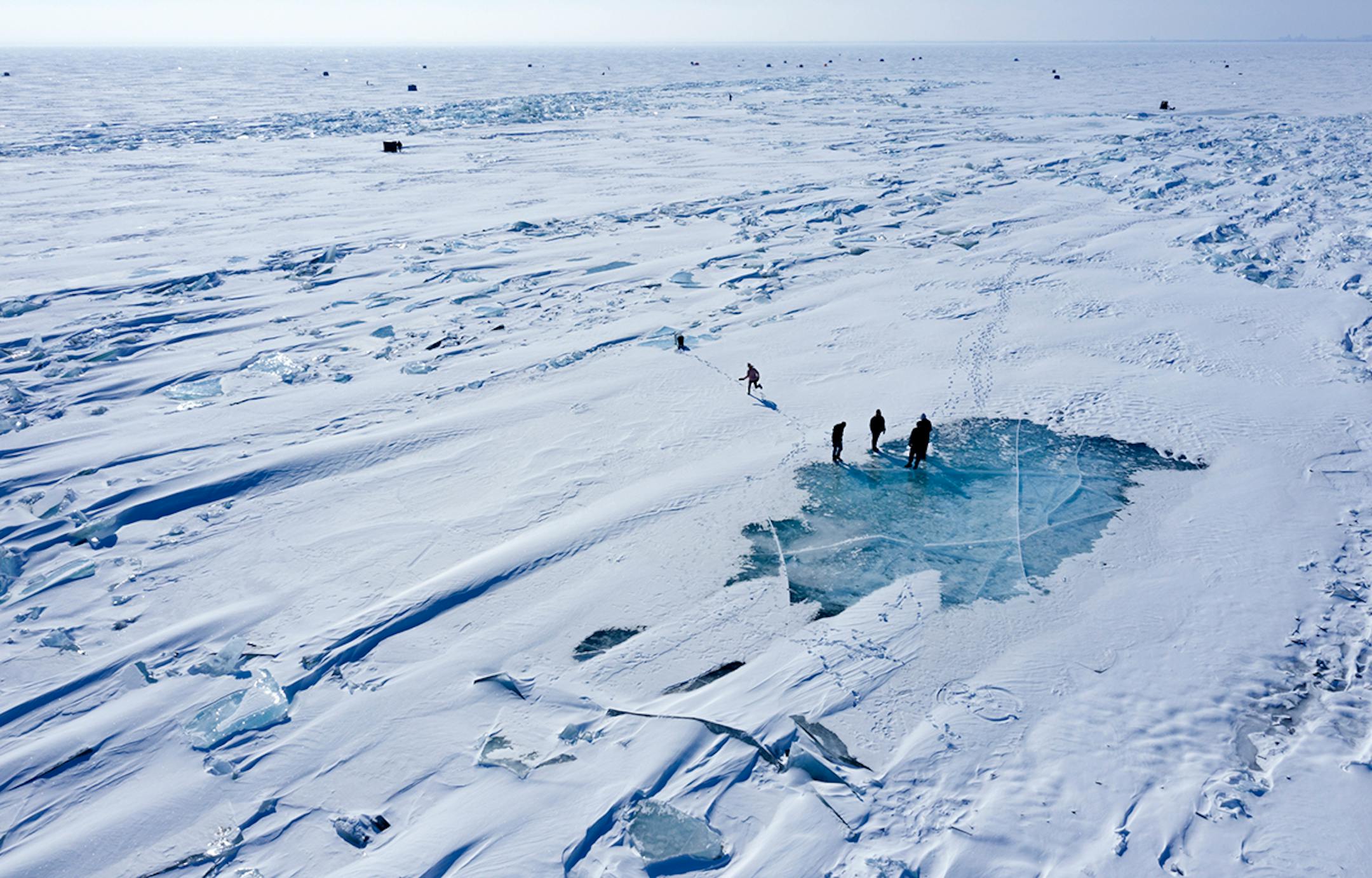 A person ran across the ice on Lake Superior, as it started to pack in along the shore near Duluth on Feb. 22, 2019. This ice is typically poor quality ice, which reacts poorly to movement due to weak bonding along the fractures.