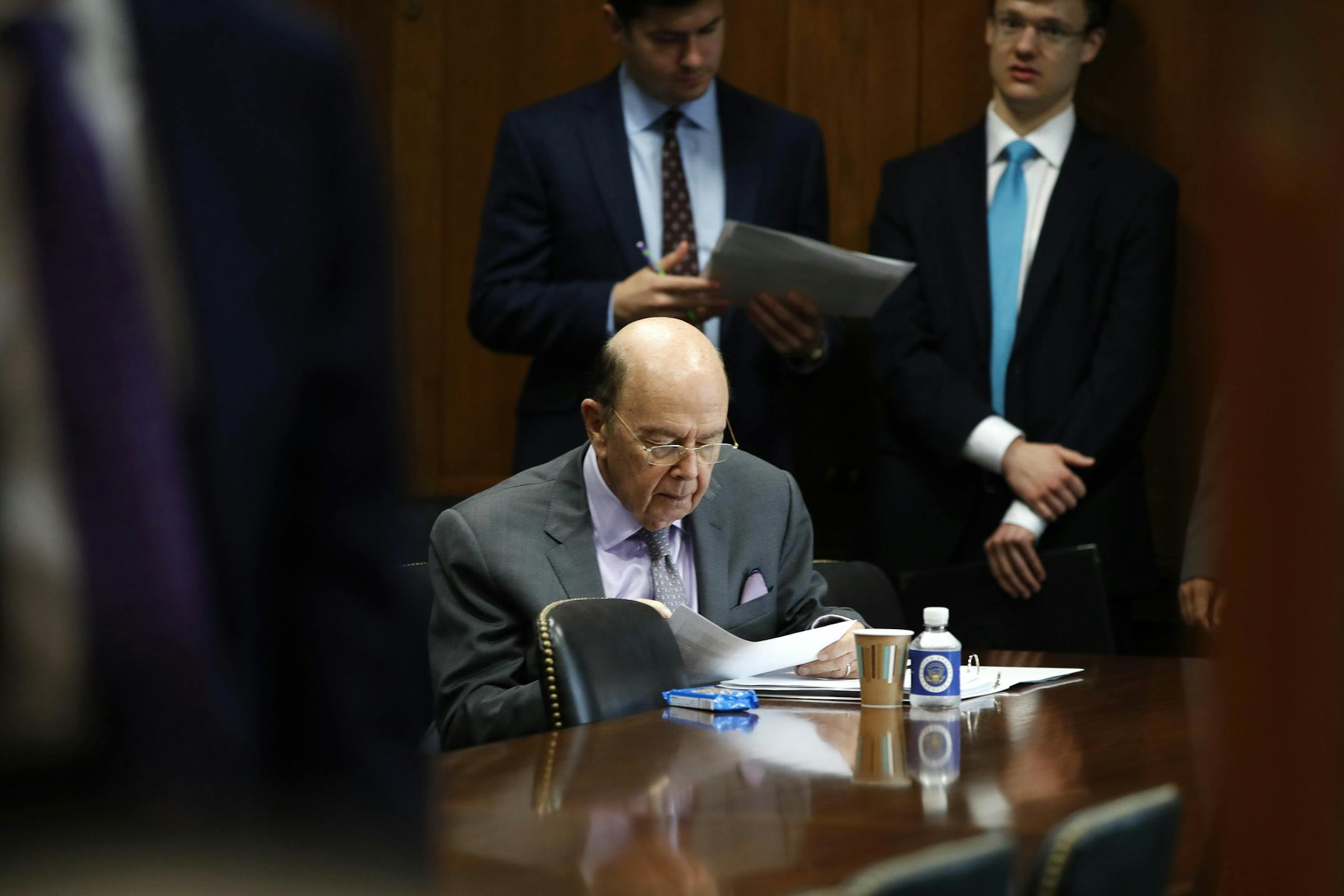 Secretary of Commerce Wilbur Ross prepares ahead of a Senate Finance Committee hearing on tariffs, on Capitol Hill, Wednesday, June 20, 2018 in Washington. (AP Photo/Jacquelyn Martin)