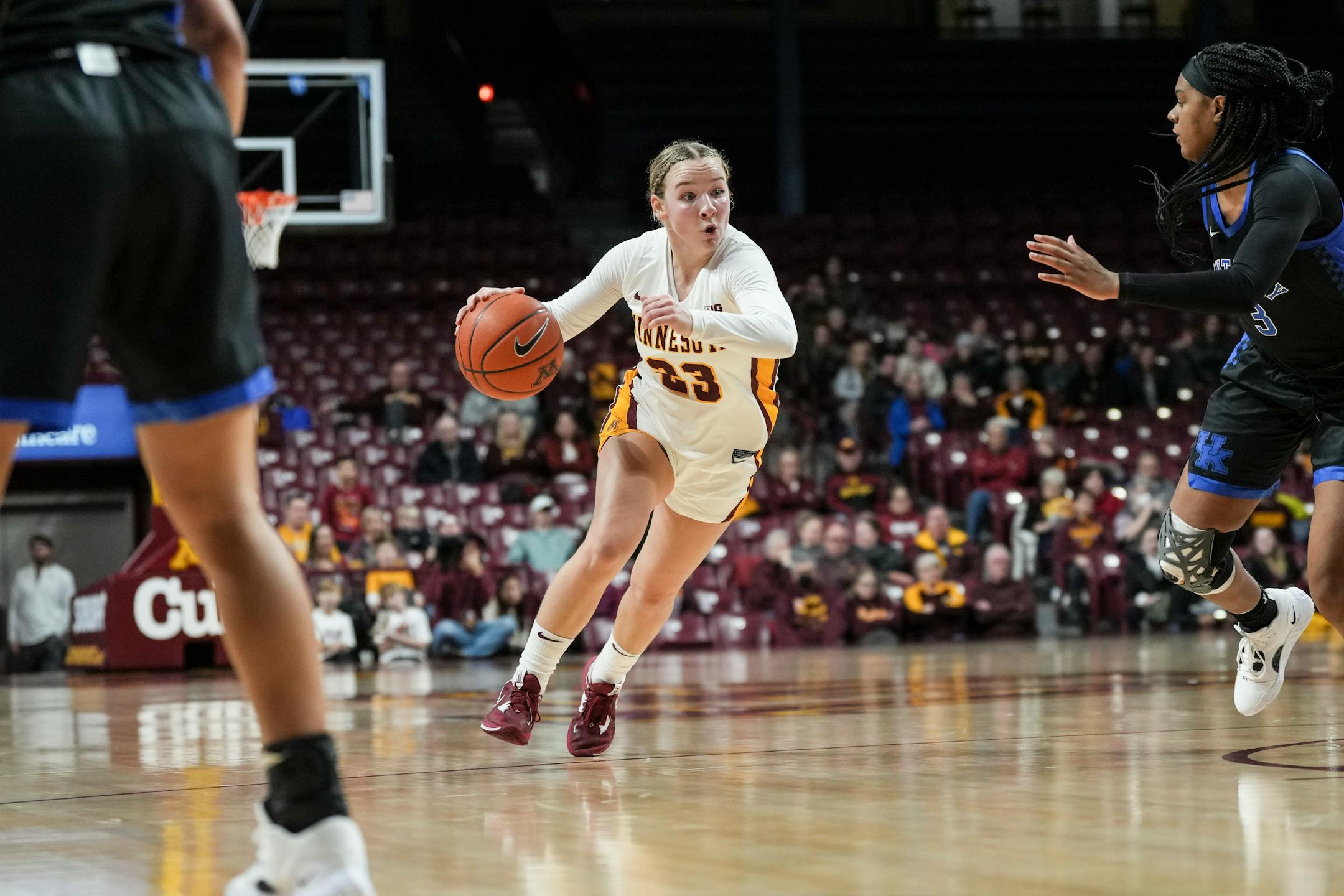 Minnesota Gophers guard Katie Borowicz (23) dribbles the ball in the first half.