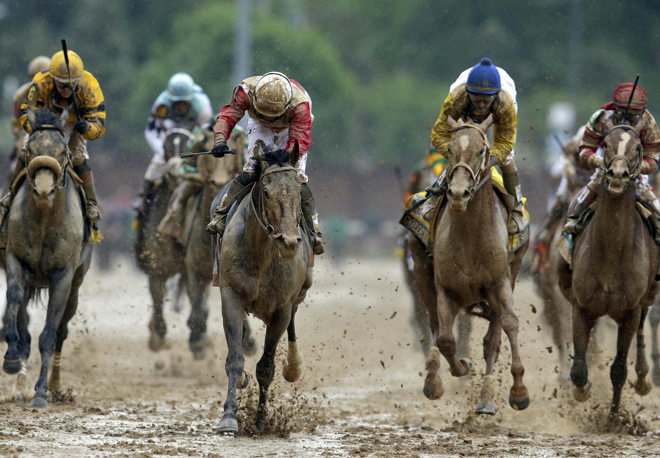 ADVANCE FOR WEEKEND EDITIONS, MAY 11-12 - In this photo taken on Saturday, May 4, 2013, jockey Joel Rosario, third from left, celebrates as Orb crosses the finish line to win the 139th Kentucky Derby horse race at Churchill Downs in Louisville, Ky. Orbís convincing 2-and-a-half length victory in the Kentucky Derby isnít scaring away potential challengers in the Preakness. The bay colt could face close to a full field of 14 for the 1 3/16-mile race at Pimlico next weekend. (AP Photo/Dar