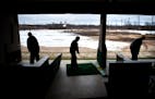 Golfers teed off at a chilly driving range in 2013.