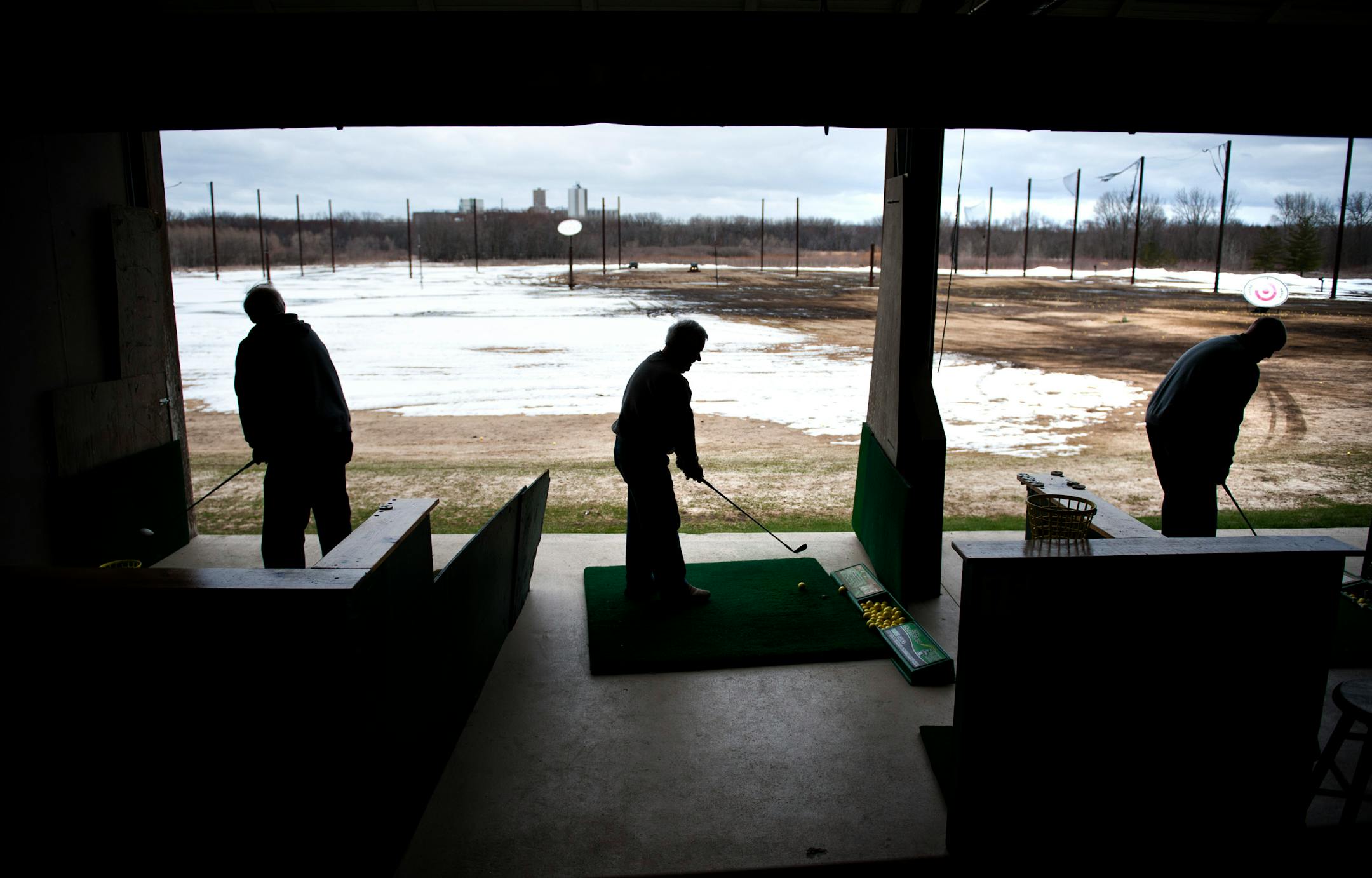 Golfers teed off at a chilly driving range in 2013.