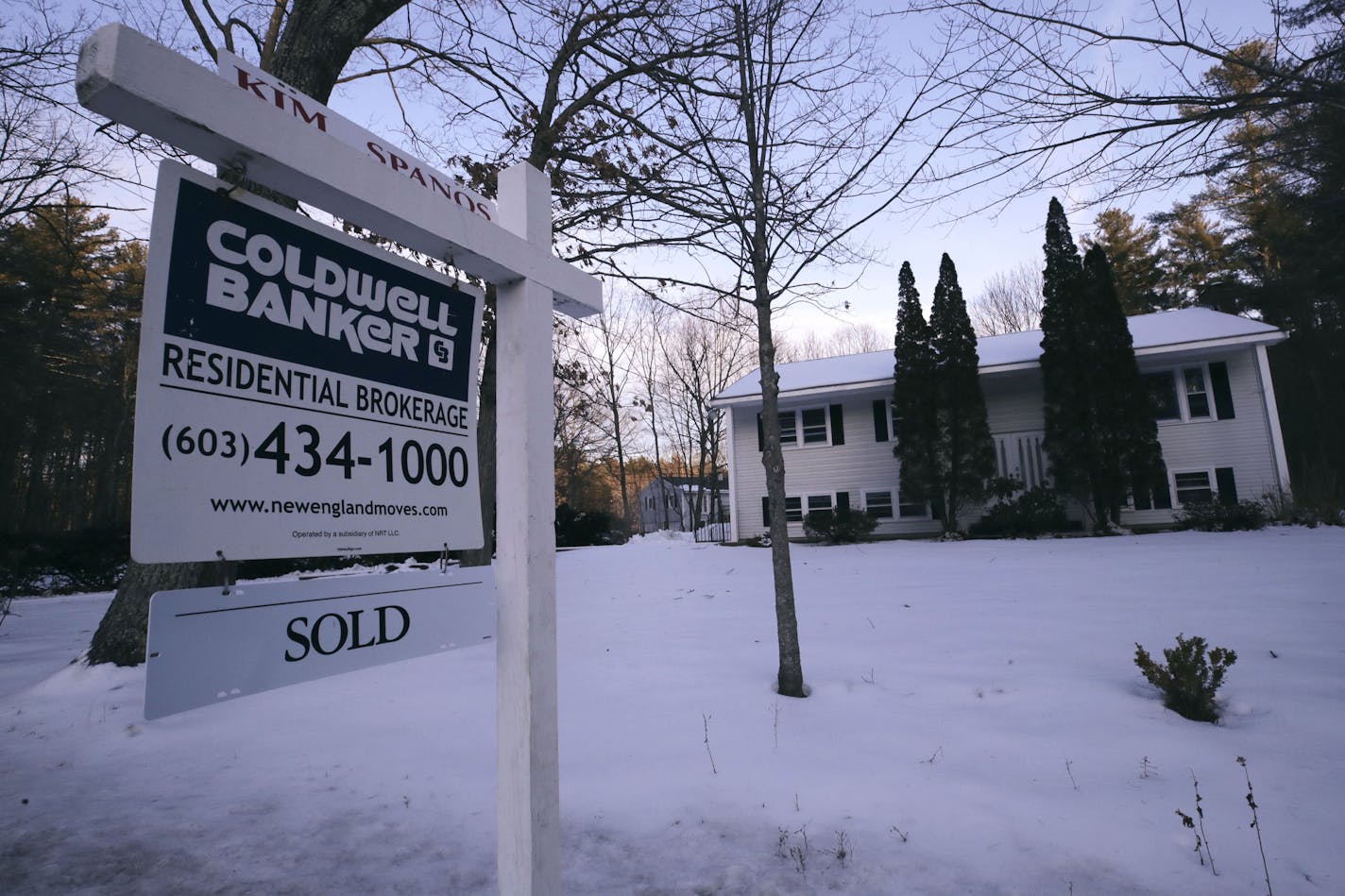 FILE - This Jan. 9, 2020, file photo shows a sold sign is posted on a real estate sign outside a home in Derry, N.H. On Thursday, March 5, U.S. long-term mortgage rates dropped to all-time lows this week as anxiety over risks to the economy deepened amid the burgeoning viral outbreak crisis. Mortgage buyer Freddie Mac says the average rate on the benchmark 30-year loan plummeted to 3.29% from 3.45% last week. (AP Photo/Charles Krupa, File)