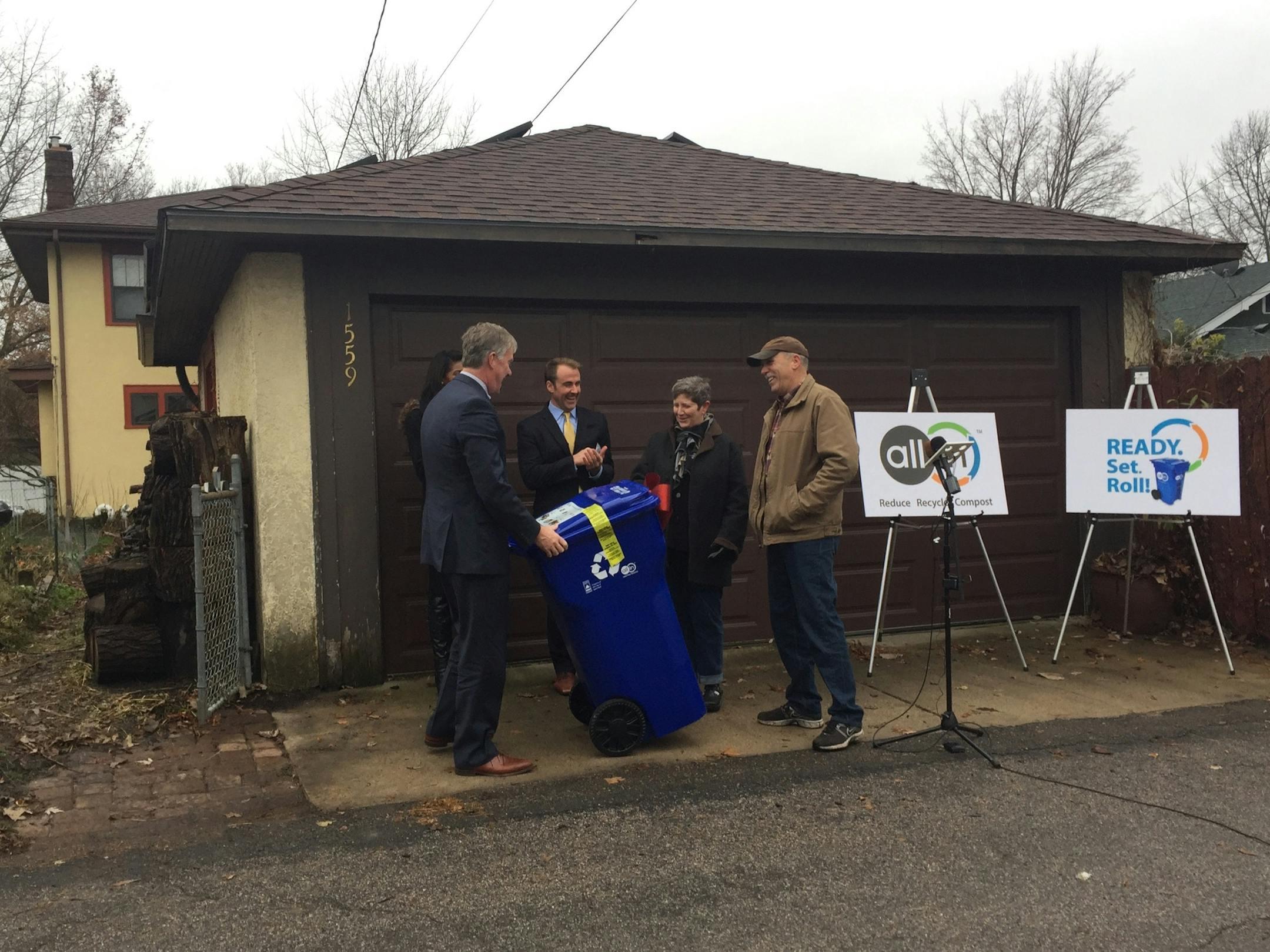 St. Paul Mayor Chris Coleman delivered one of the city's new lidded recycling bins to resident Sheila Sweeney.