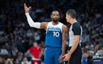 Mike Conley of the Wolves has a friendly discussion with a referee during a game on April 12 at Target Center. The point guard was named the NBA Teamm