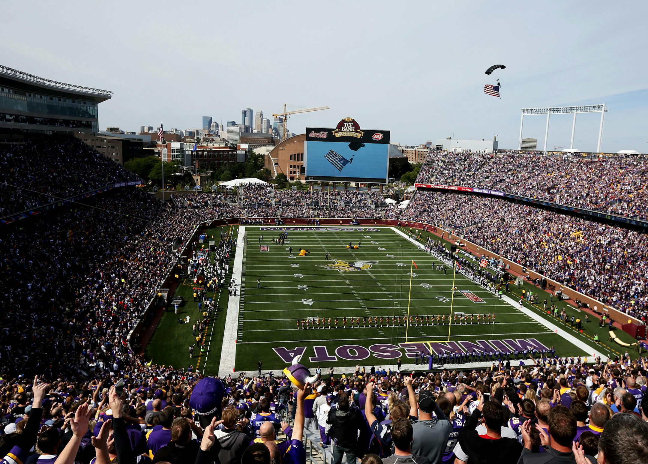 The American flag was bought in the TCF Bank Stadium by a skydiver on Sunday at TCF Bank Stadium.The Minnesota Vikings hosted the New England Patriots at TCF Bank Stadium Sunday September 14 , 2014 in Minneapolis , MN. ] Jerry Holt Jerry.holt@startribune.com