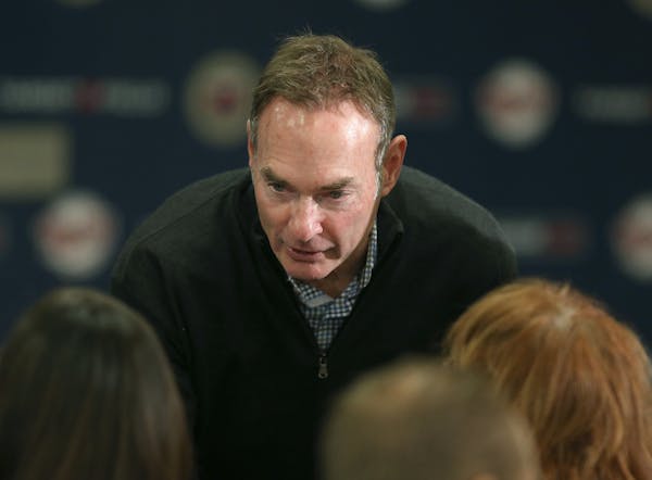 Twins manager Paul Molitor greeted the families of Derek Falvey and Thad Levine before a news conference at Target Field on Monday.