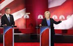 Democratic presidential candidate, Hillary Clinton, center, speaks at the NBC, YouTube Democratic presidential debate at the Gaillard Center, Sunday, 