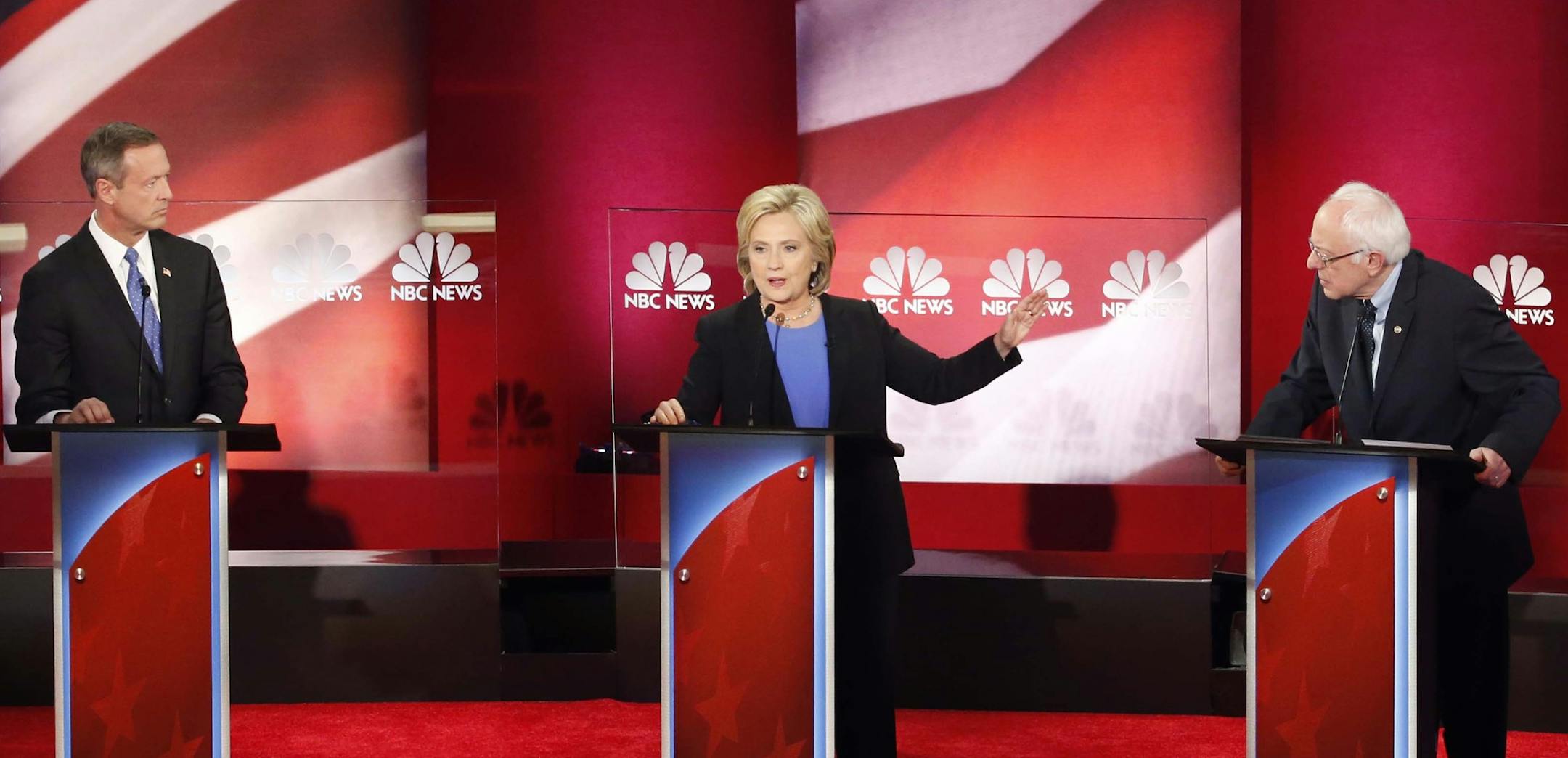 Democratic presidential candidate, Hillary Clinton, center, speaks at the NBC, YouTube Democratic presidential debate at the Gaillard Center, Sunday, Jan. 17, 2016, in Charleston, S.C. To the left is Democratic presidential candidate, former Maryland Gov. Martin O'Malley and Democratic presidential candidate, Sen. Bernie Sanders, I-Vt, left. (AP Photo/Stephen B. Morton)