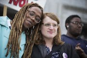Kya Concepcion, left, and JayCee Cooper, both of Minneapolis, share a moment together during a Transgender Day of Visibility rally at the Capitol in S