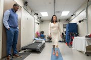 Juan Cave II, an advanced research prosthetist-orthotist, watched as Kelly Yun, a prosthetic technician and designer, demonstrates the Modular Prosthe