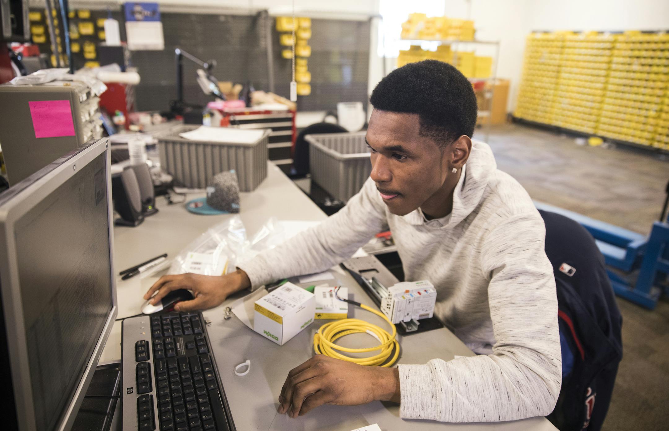 Kamonty Wade works on building an ethernet hub box at Rudolph Technologies. ] LEILA NAVIDI • leila.navidi@startribune.com BACKGROUND INFORMATION: Kamonty Wade, a Summit Academy graduate, works at Rudolph Technologies in Bloomington on Friday, March 17, 2017. In 2012, the Minnesota Department of Human Rights raised the requirement for workforce diversity on public construction projects from 11 percent workers of color to 32 percent workers of color. Minneapolis and other jurisdictions have