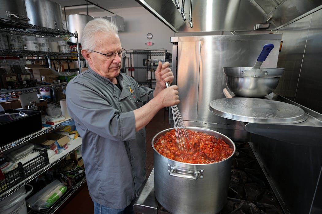 Mark Porisch, founder of Lucky’s Sauces, cooks a batch of Ghost Peppers for his El Camino Diablo hot sauce.
