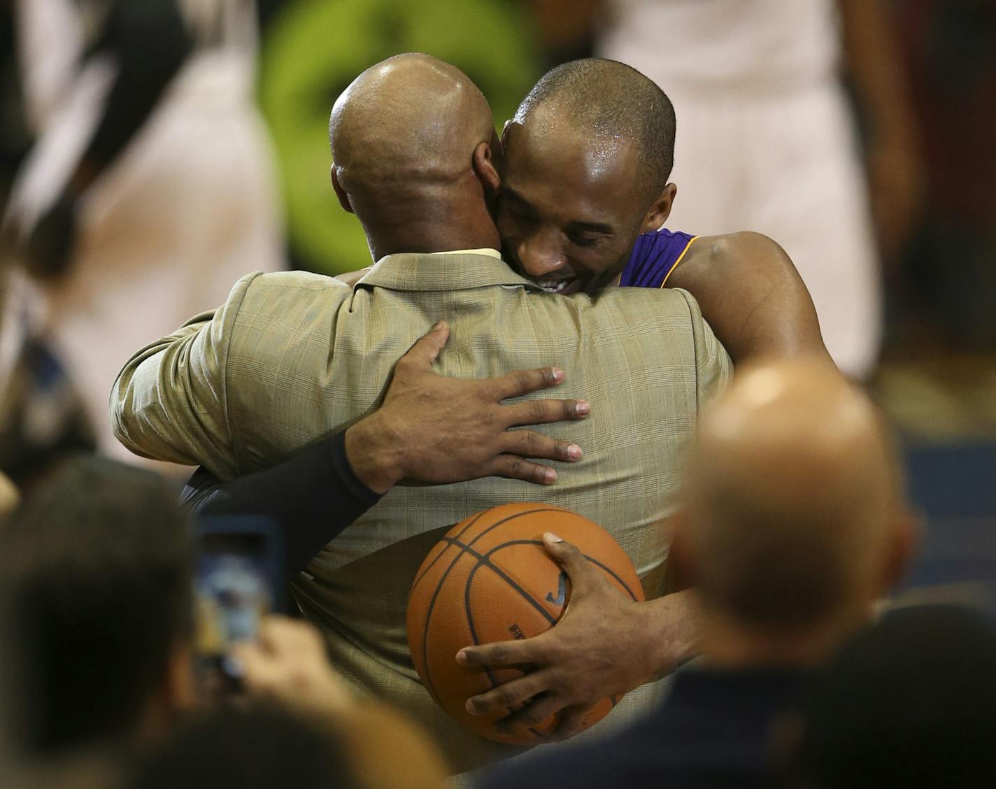 The Lakers' Kobe Bryant embraced Los Angeles head coach Byron Scott after he moved past Michael Jordan on the all time scoring list in the second quarter Sunday night at Target Center in Minneapolis. ] JEFF WHEELER &#xe2;&#x20ac;&#xa2; jeff.wheeler@startribune.com The Minnesota Timberwolves hosted the Los Angeles Lakers in an NBA game Sunday night, December 14, 2014 at Target Center in Minneapolis. The Lakers' Kobe Bryant surpassed Michael Jordan on the all-time scoring list in the second quarte