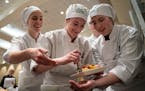 Monticello High School teammates work on their entree during the 18th annual Minnesota ProStart Invitational. Students were judged by local chefs on t