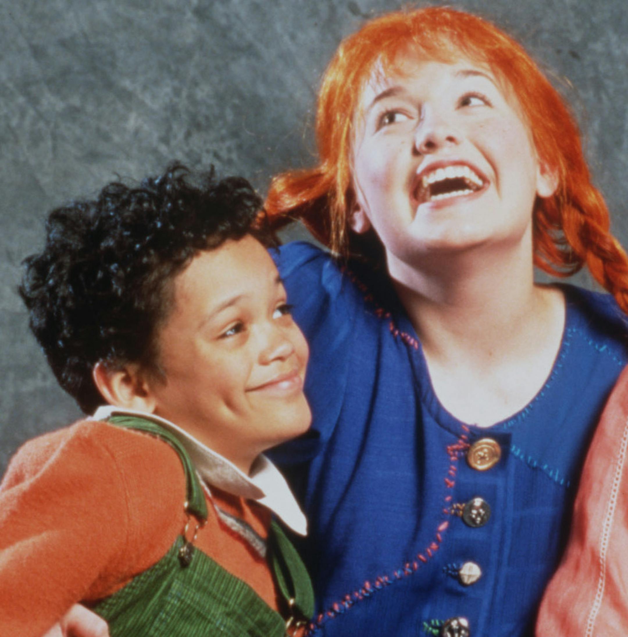 Pippi (Britta Ollmann) pals around with her new neighbors, Tommy (Nathan Barlow) and Annika (Caroline Innerbichler), in Pippi Longstocking at The Chidern's Theatre Company.