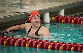 Eden Prairie's Caroline Larsen looks back at the scoreboard after finishing the 50M free at the Class 2A girls' swimming state meet at the Jean K. Fre