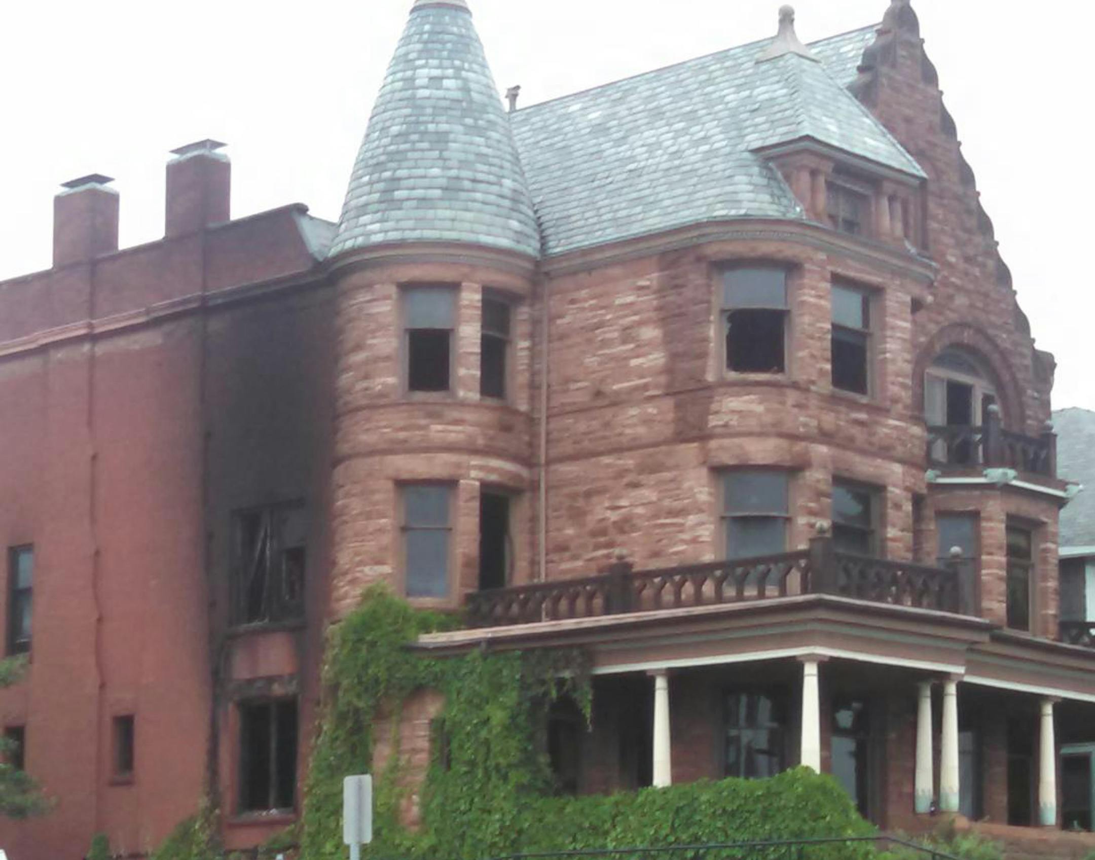 Fire damage can be seen on the side of the historic Traphagen House on Superior Street in Duluth.