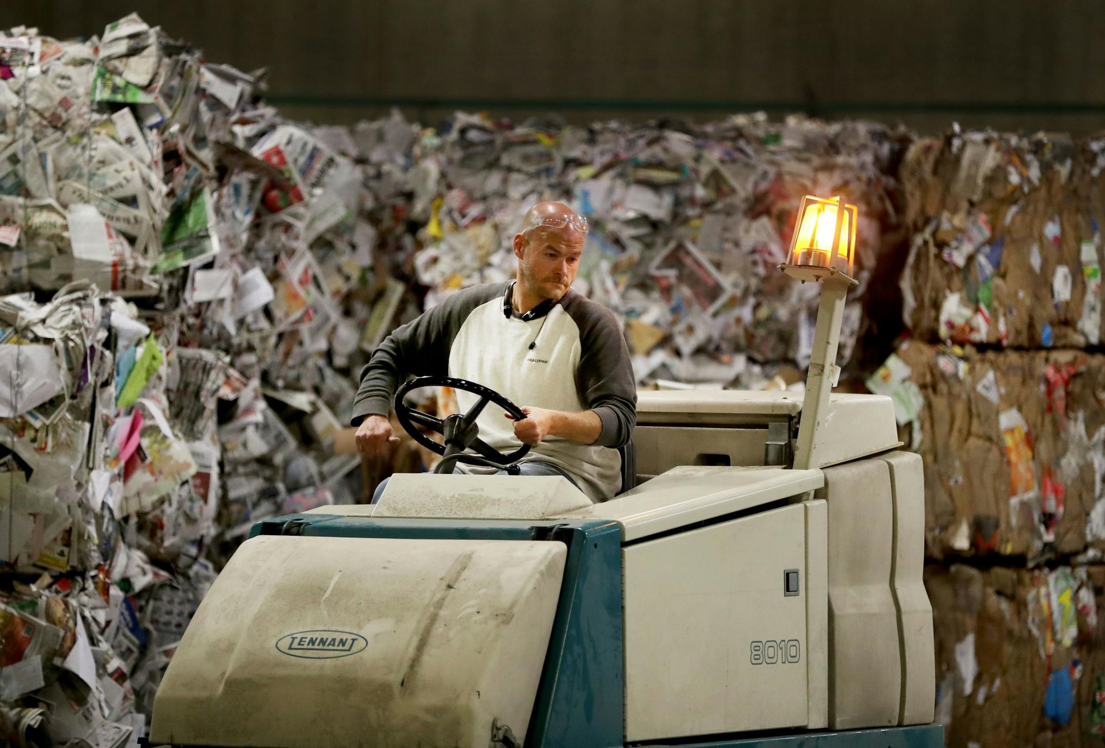 Disabled workers like John Week, 37, have opportunities that they never thought possible. Workers who once toiled for years in dead-end jobs are now making up to $14 an hour at an MDI facility and have opportunities for advancement. Here, Week uses a machine to clean up the recycling floor before most of the other workers arrive for the day Tuesday, Sept. 27, 2016, in Cohasset, MN.