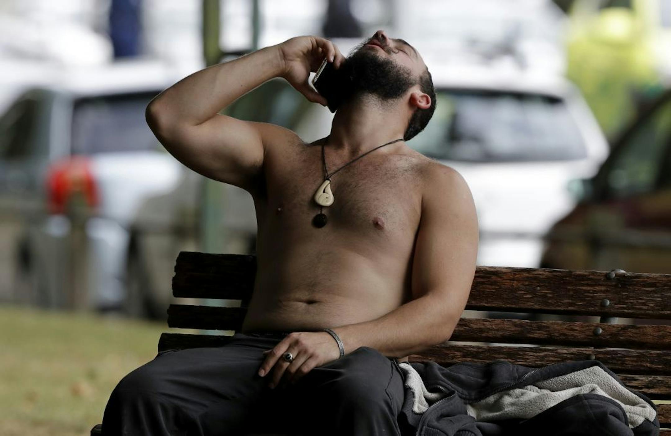 A man reacts as he speaks on a mobile phone outside a mosque in central Christchurch, New Zealand, Friday, March 15, 2019. A witness says many people have been killed in a mass shooting at a mosque in the New Zealand city of Christchurch.