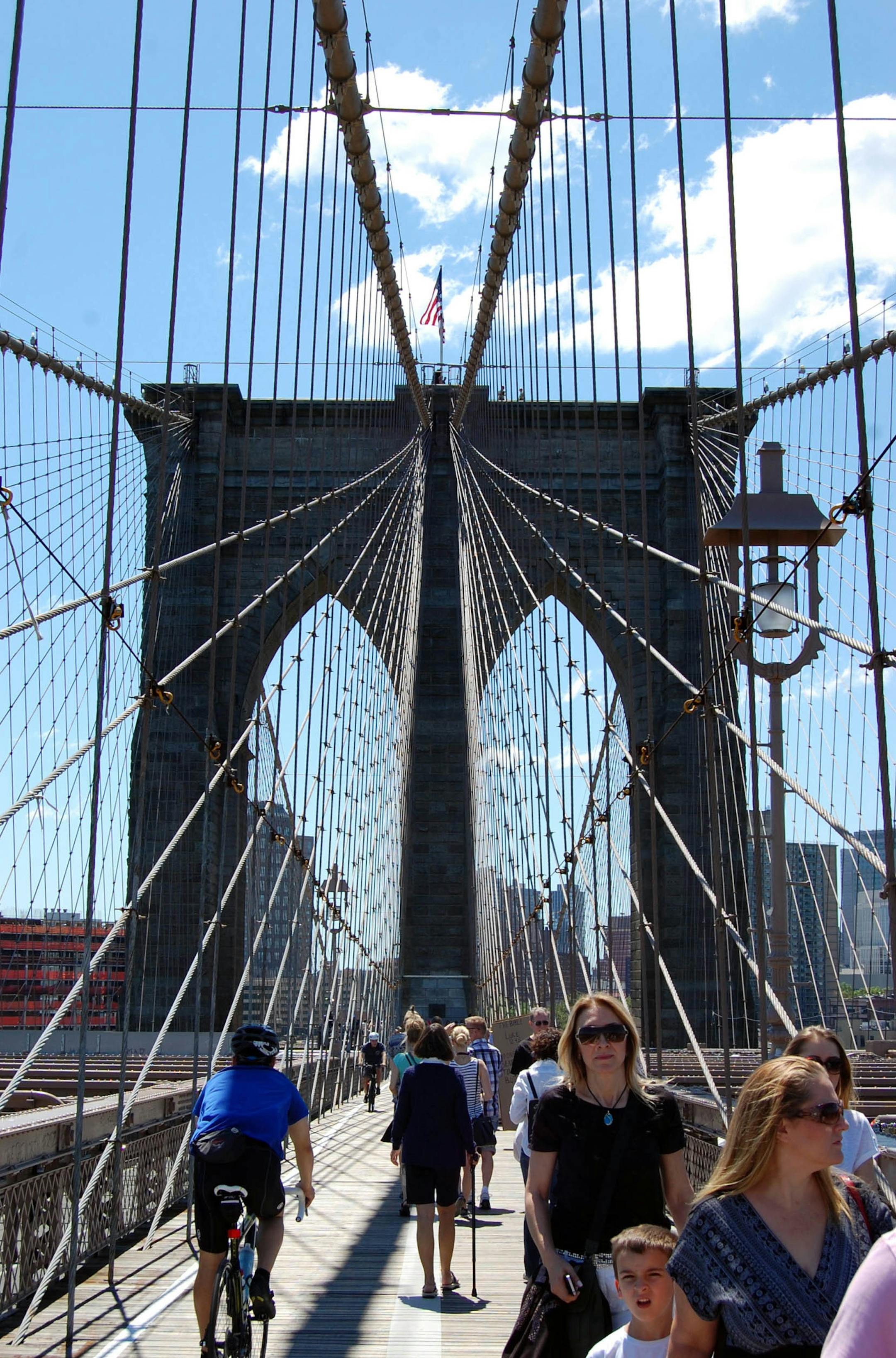 On busy days, the walking the Brooklyn Bridge can become a bit of an obstacle course, with walkers, bicyclists and venders all vying for space.