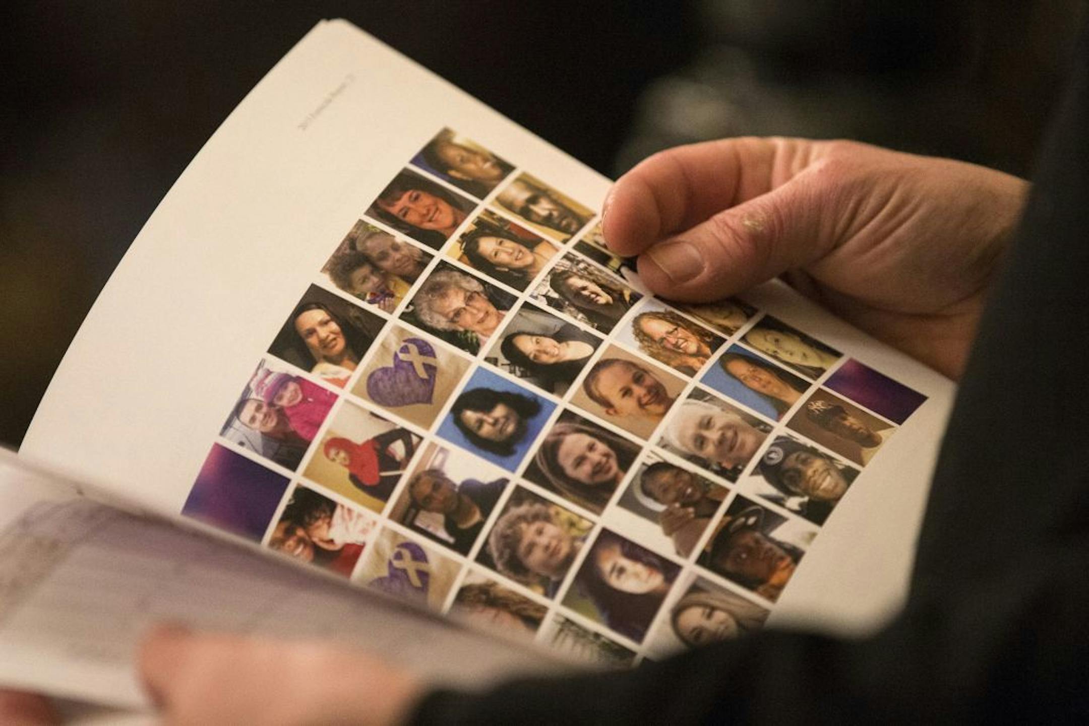 Photos of people who have been murdered as a result of domestic violence are seen in a booklet during a press conference held by the Minnesota Coalition for Battered Women at the State Office Building in St. Paul on Tuesday, January 26, 2016.