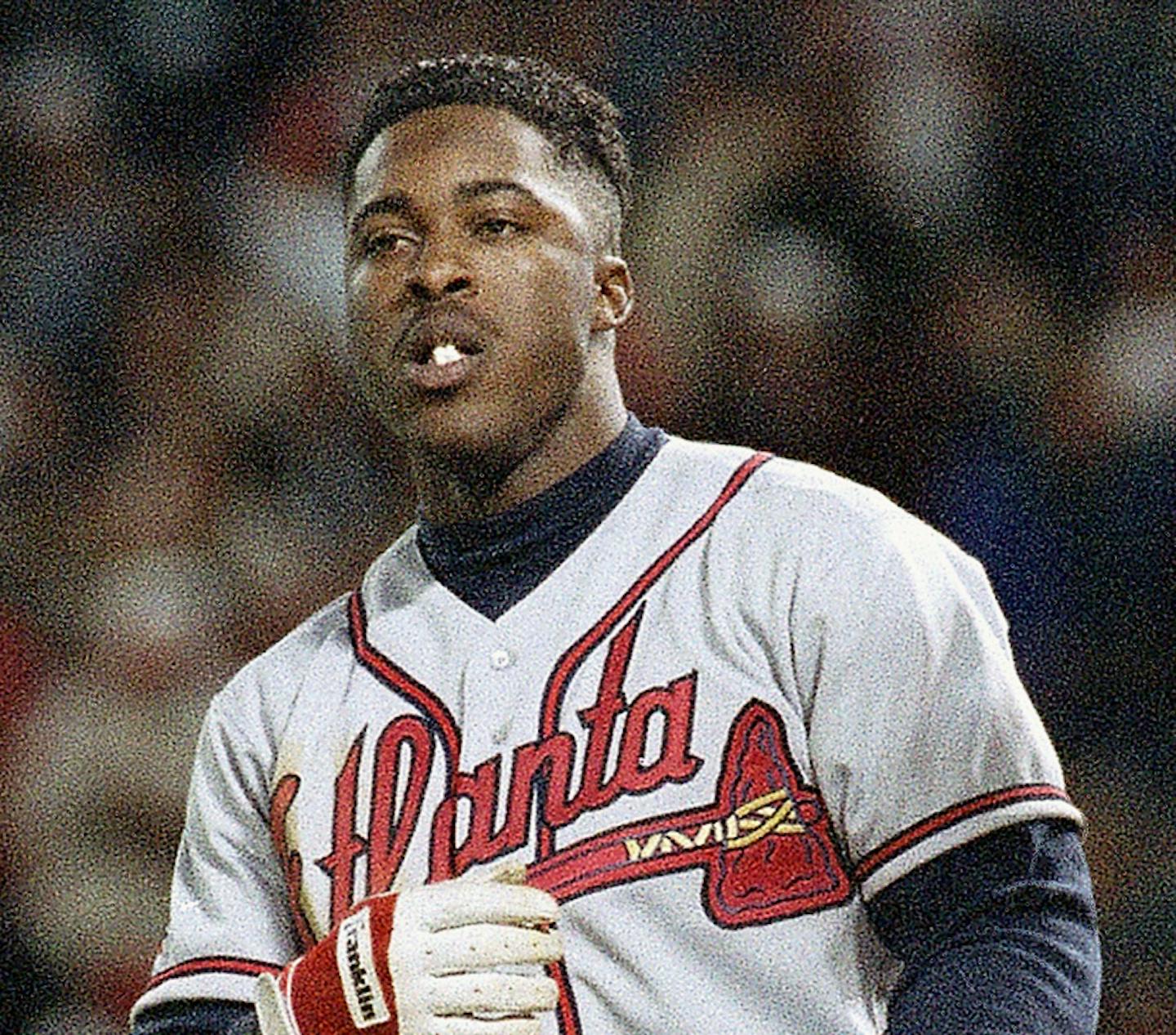 Atlanta Braves left fielder Ron Gant tosses his helmet after striking out to end the top half of the ninth inning of Game 1 of the National League Championship Series at Veterans Stadium in Philadelphia Wednesday, Oct. 6, 1993. (AP Photo/AMY sANCETTA) ORG XMIT: APHS177715